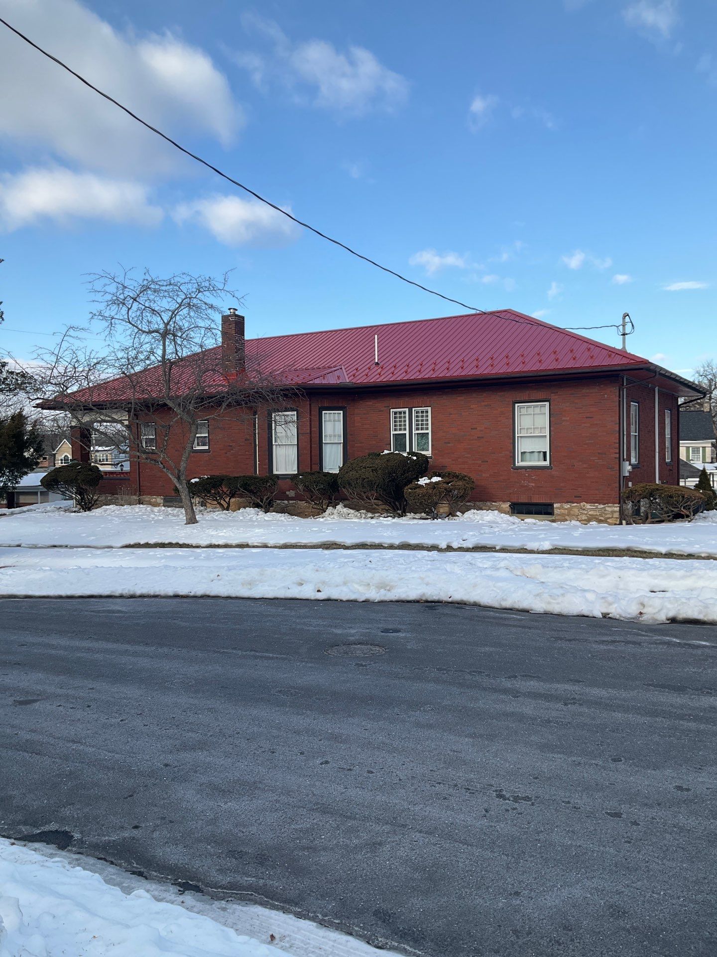 Red Metal Roofing Upgrade for Brick Home by Esh Builders