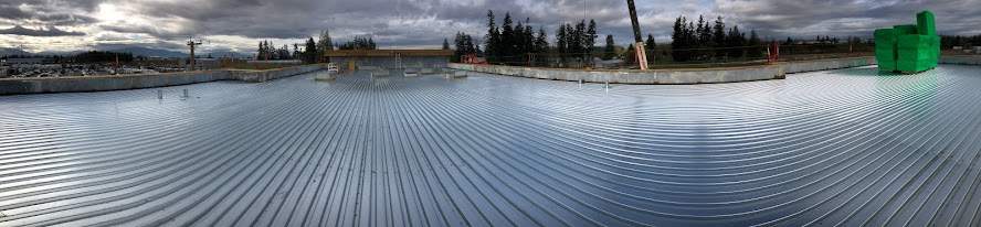 Commercial Roofing Installation using EPDM loose lay with balast by Top Notch Roofing Inc