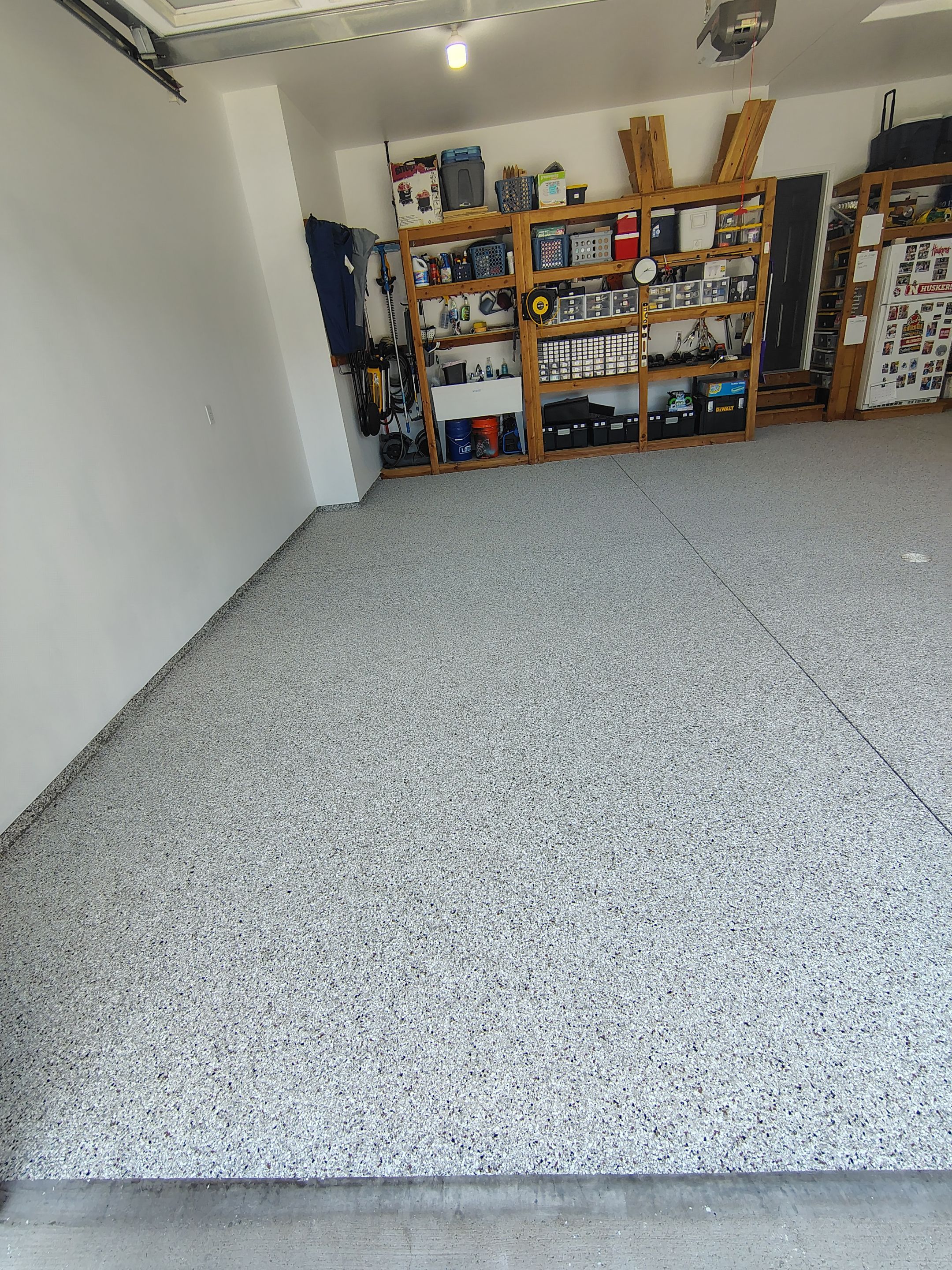 Coyote Garage Floor Coating in Sioux Falls by Select Painting, Coatings & Garage Cabinets