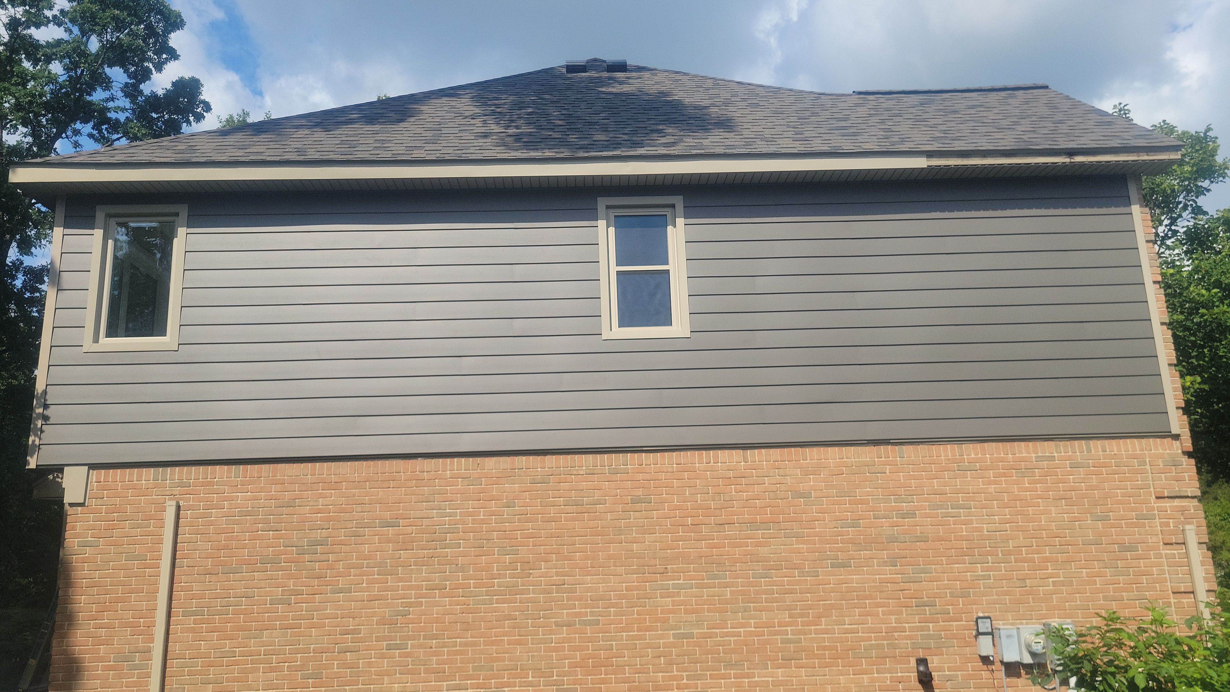 Roof Replacement using Owens Corning Peppercorn and Siding Replacement using Ascend Charcoal Smoke by 180 Contractors