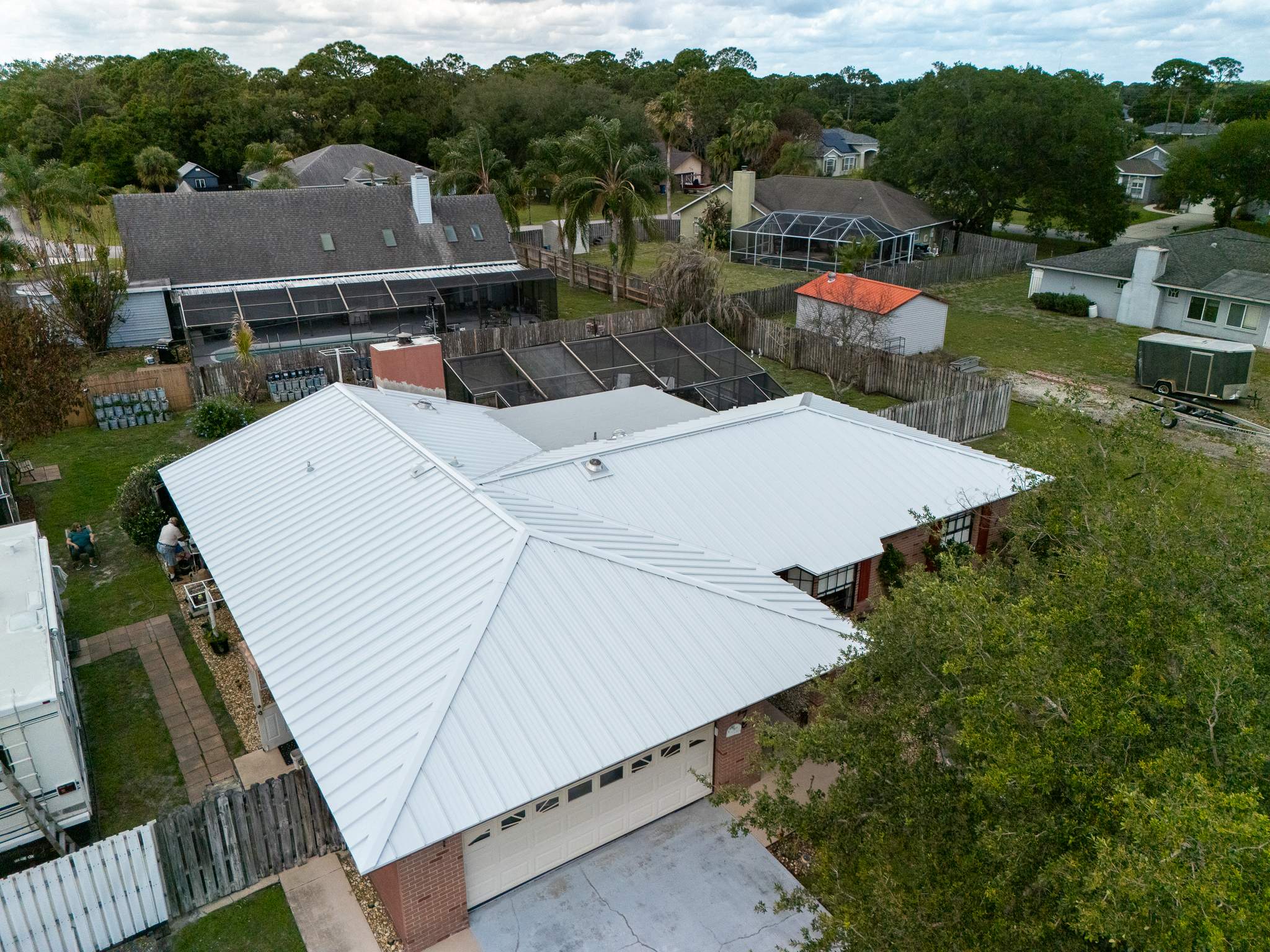 White Standing Seam Metal Roof Replacement and Hurricane Reinforcement in Palm Bay, Florida by Wiedmann Construction & Roofing