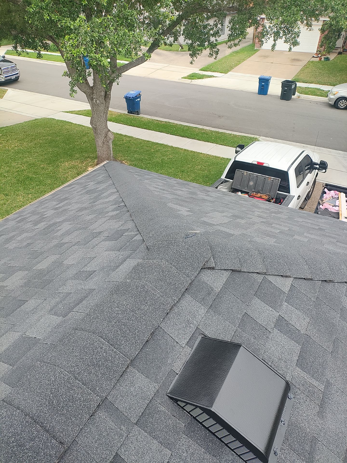 Nothing looks nicer than a little black roof by Bayfront Roofing and Construction
