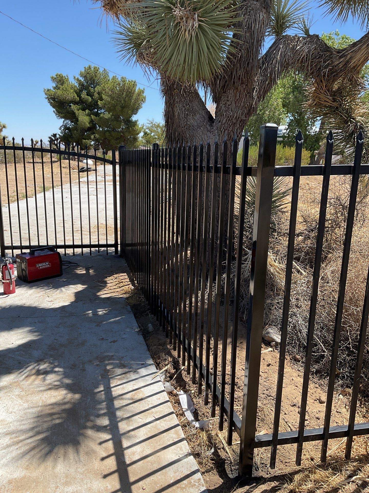 Gate installation using Wrought Iron by Fence Guys Inc. 