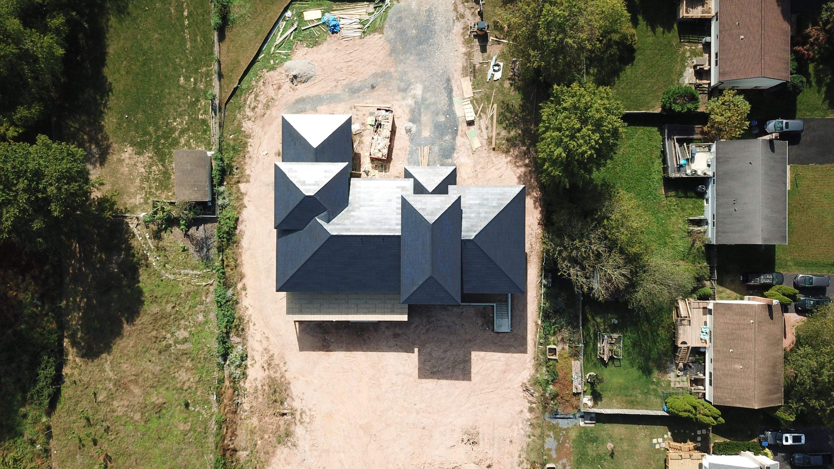 Tesla Solar Roof  using Tesla Solar Roof V3 tiles by American Home Contractors