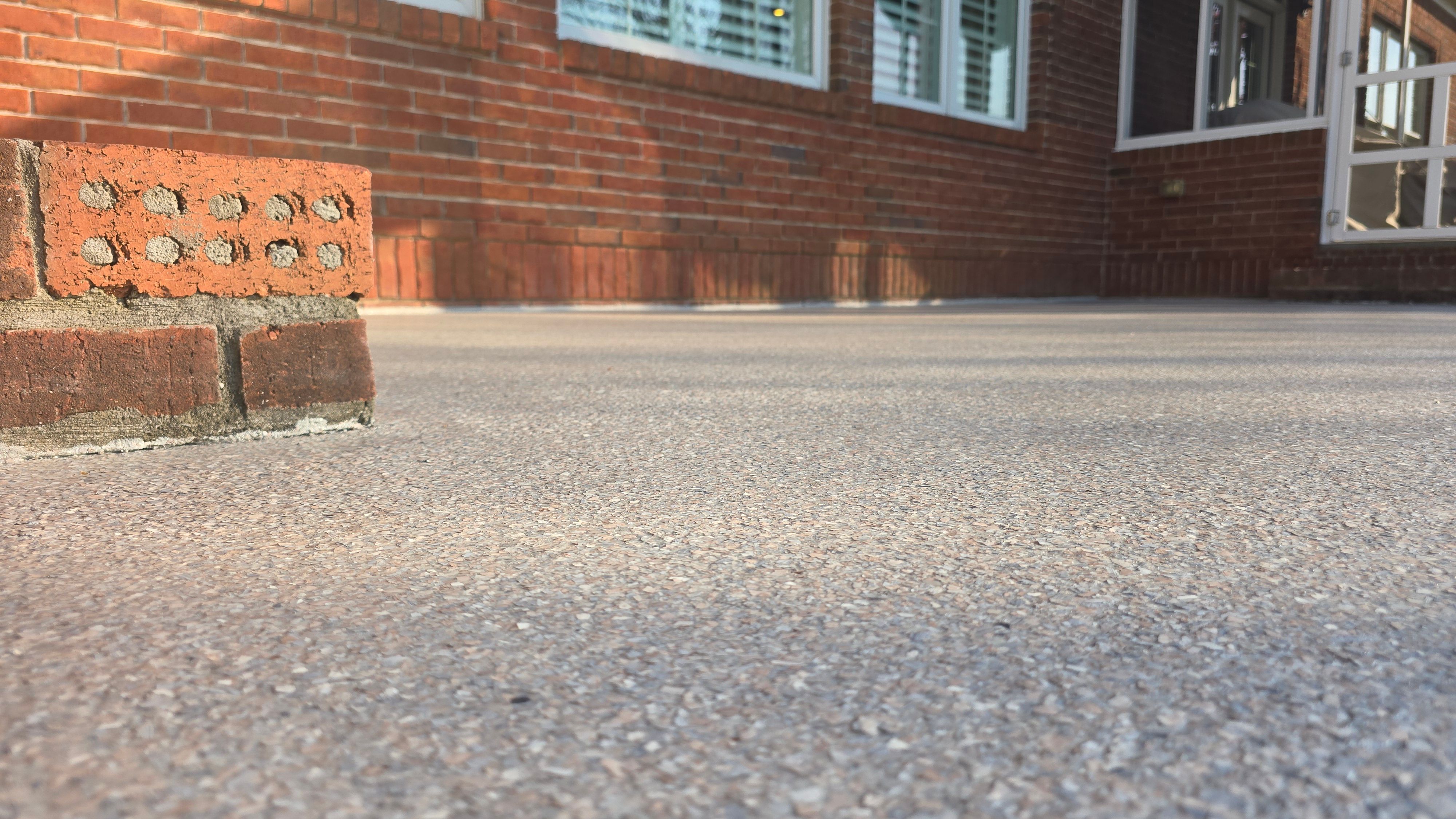 Patio in Pumice with Obsidian Border  by Elite Floor Solutions