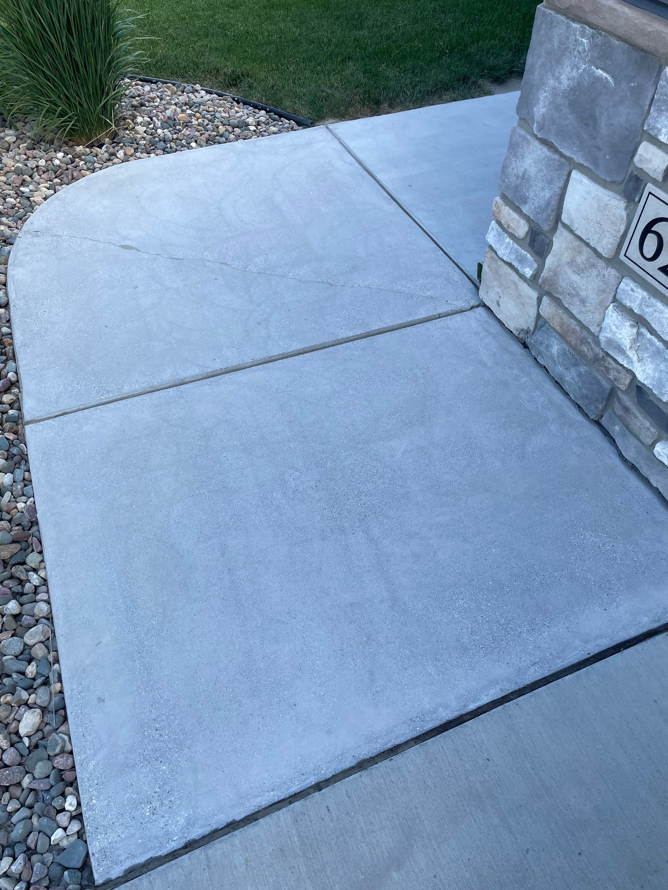 Textured Concrete Patio Coating and Custom Privacy Pergola in Sioux Falls by Select Painting, Coatings & Garage Cabinets