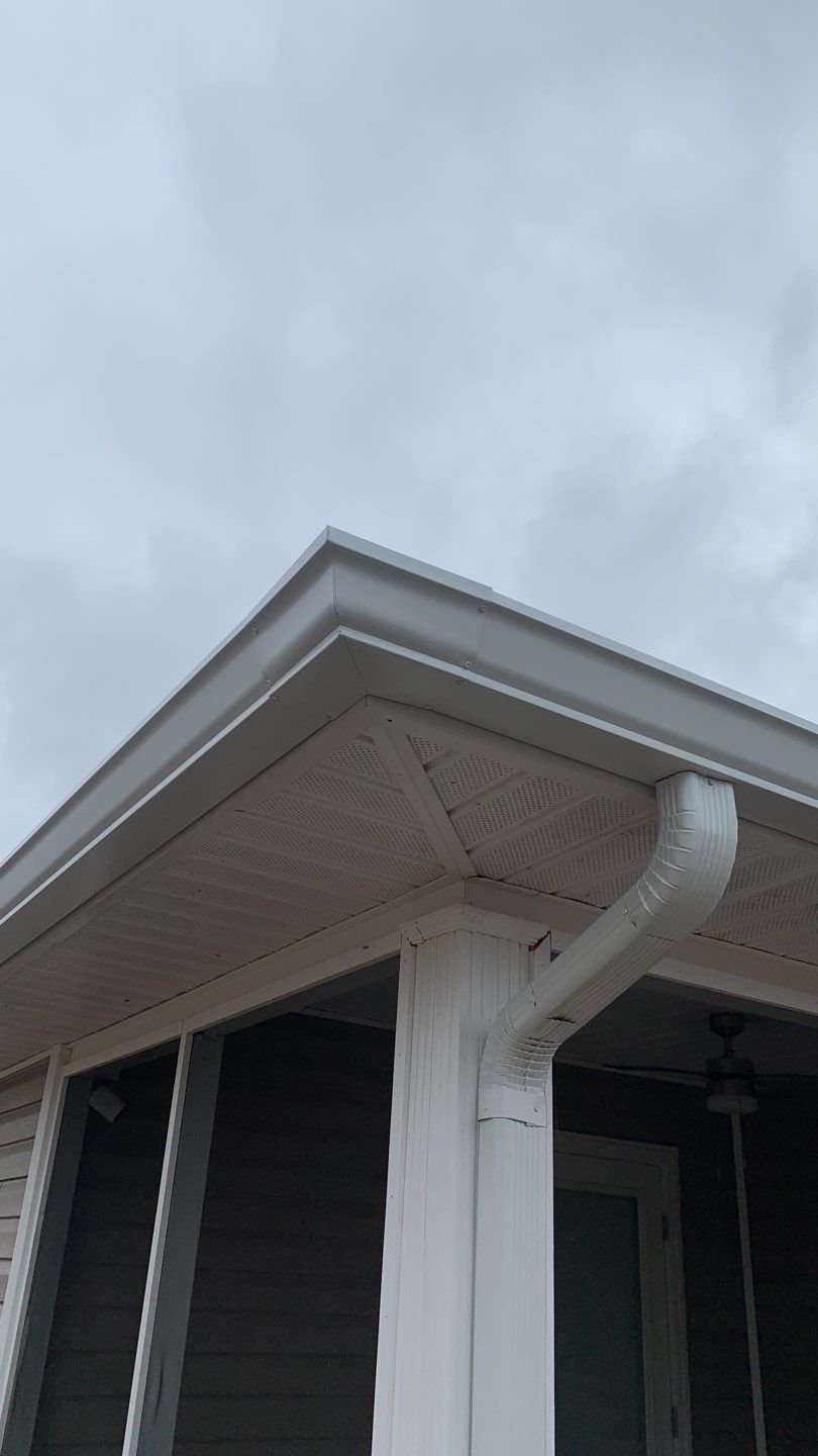 Seamless Gutter Installation Using White 6 Inch Gutters by Gutter Professors