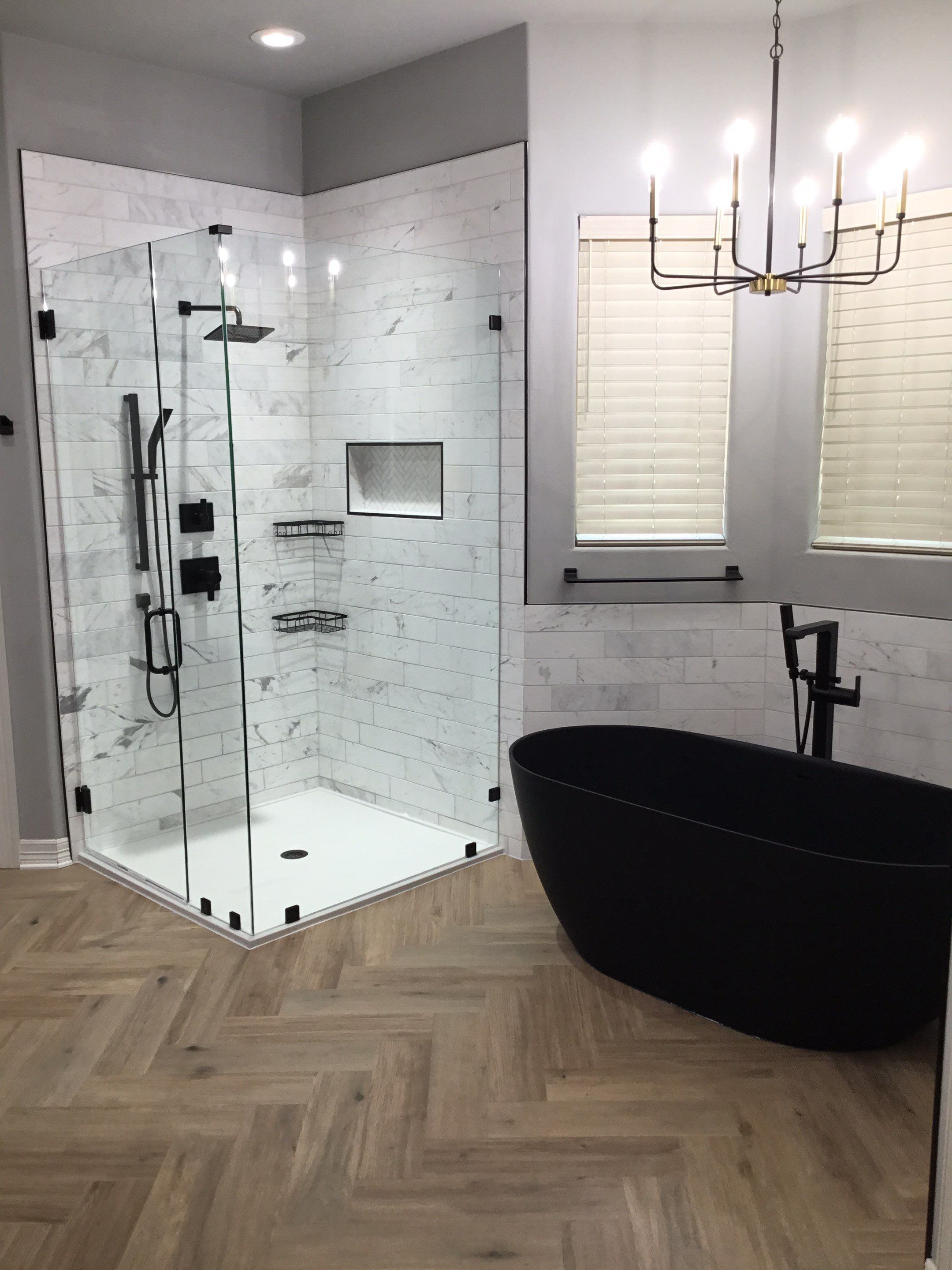 Spring Bathroom Remodel with Black Free-Standing Tub and Walk-In Shower by Legacy Bath and Kitchen