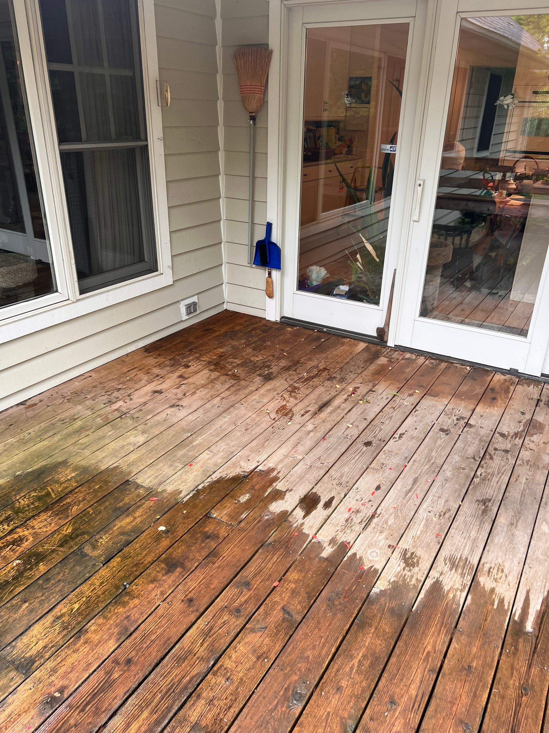 Wood deck cleaning, board replacement and staining by Northern Power Washing LLC.