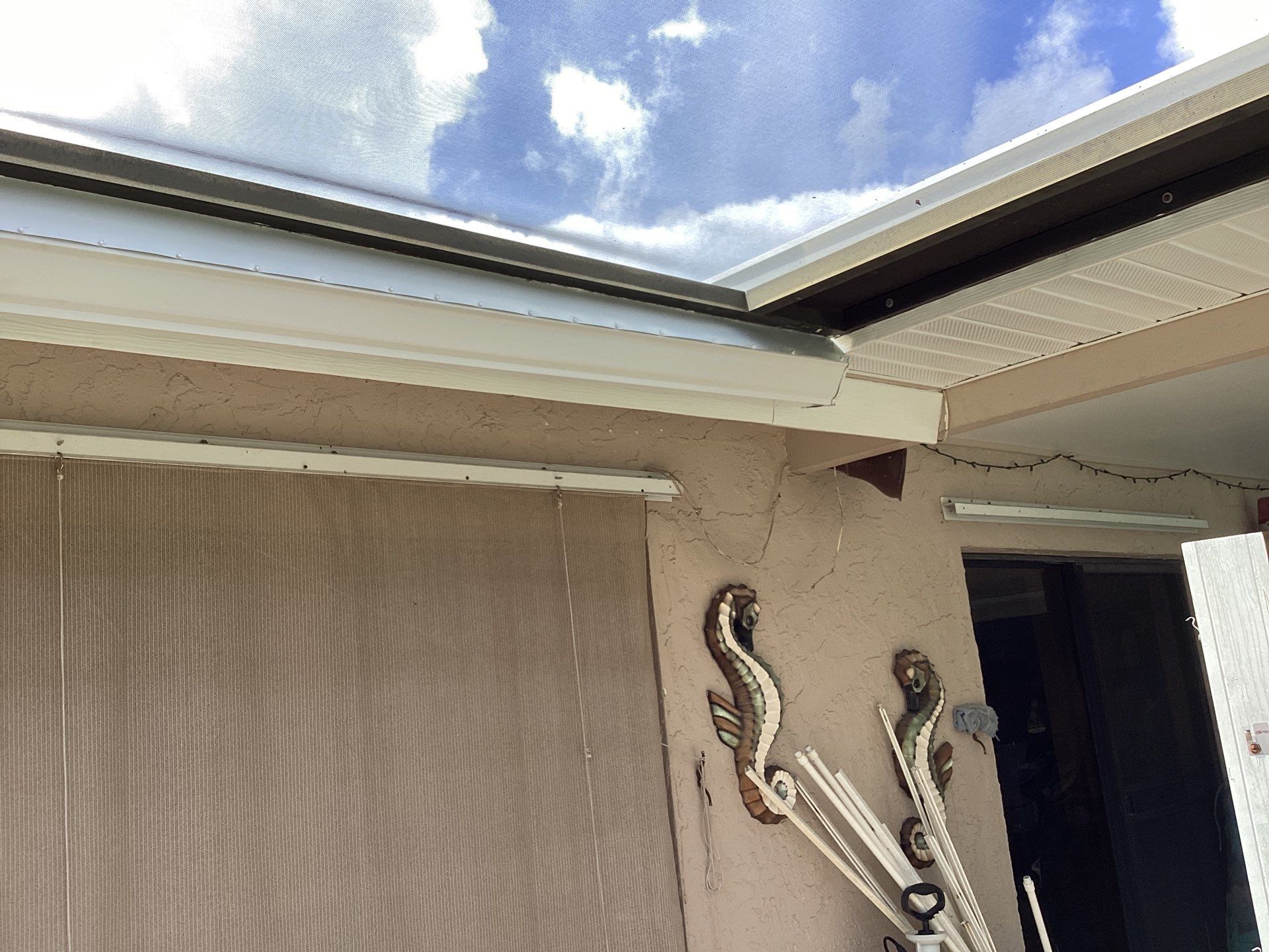 White Seamless Gutters and Splash Guards in Fort Myers FL by Gutter Professor by Gutter Professors