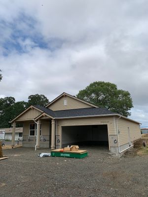 Seamless White Gutter Installation for Eugene New Construction Home by BEST Roofing & Waterproofing