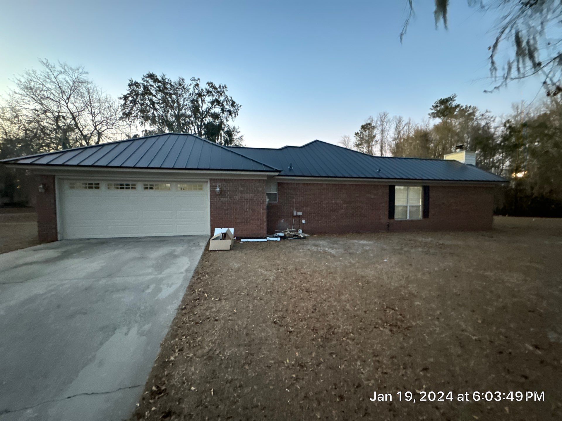 Residential Roofing Installation using Benton 26Ga 1inc Snapcock Metal Roof KYNAR Matte Black by Talya Roofing