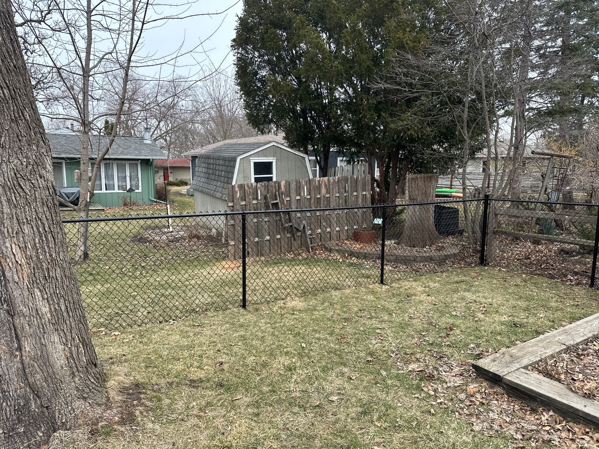 Black Vinyl Chain Link Fence Installation in Cedar Falls by Perfect Picket Fence and Stain