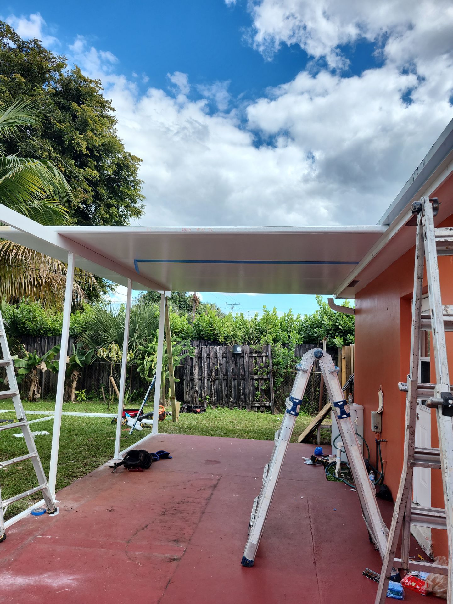 Insulated Screen Enclosure and Wood Tile Deck Installation in Plantation by Aastro Roofing
