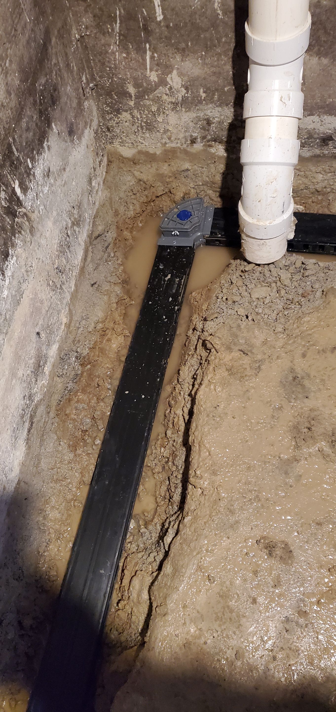 Interior Basement Waterproofing System using GrateDrain Waterproofing System by Toledo Basement Repair 