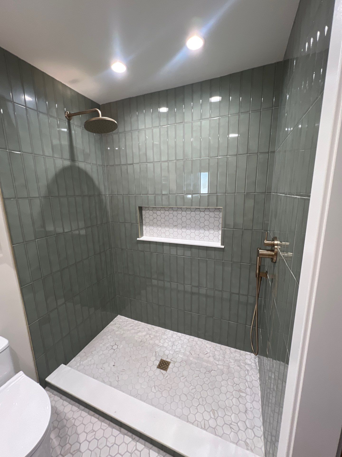 Custom Bathroom Remodel with Heated Floors and Vertical Sage Tile by  H4H Remodeling and Repairs Inc.