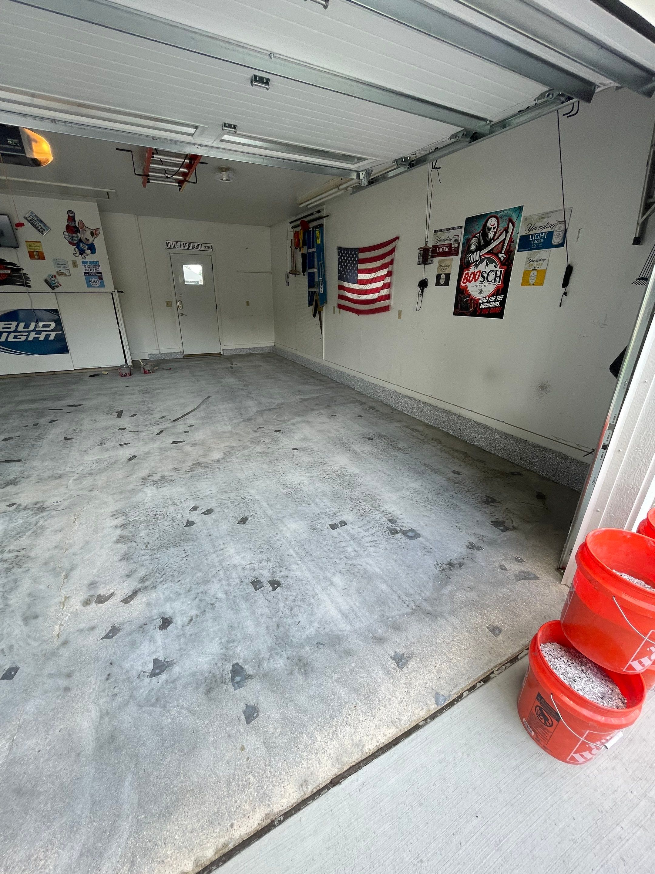 Residential Garage Floor Coating with Feather Grey Finish in Sioux Falls by Select Painting, Coatings & Garage Cabinets