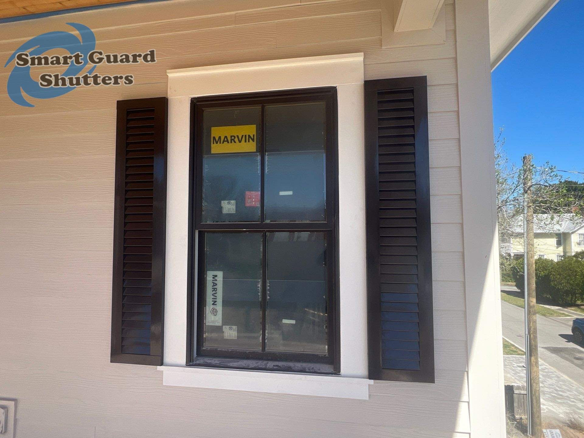 Decorative Colonial Shutters in Grey Brown by Smart Guard Shutters