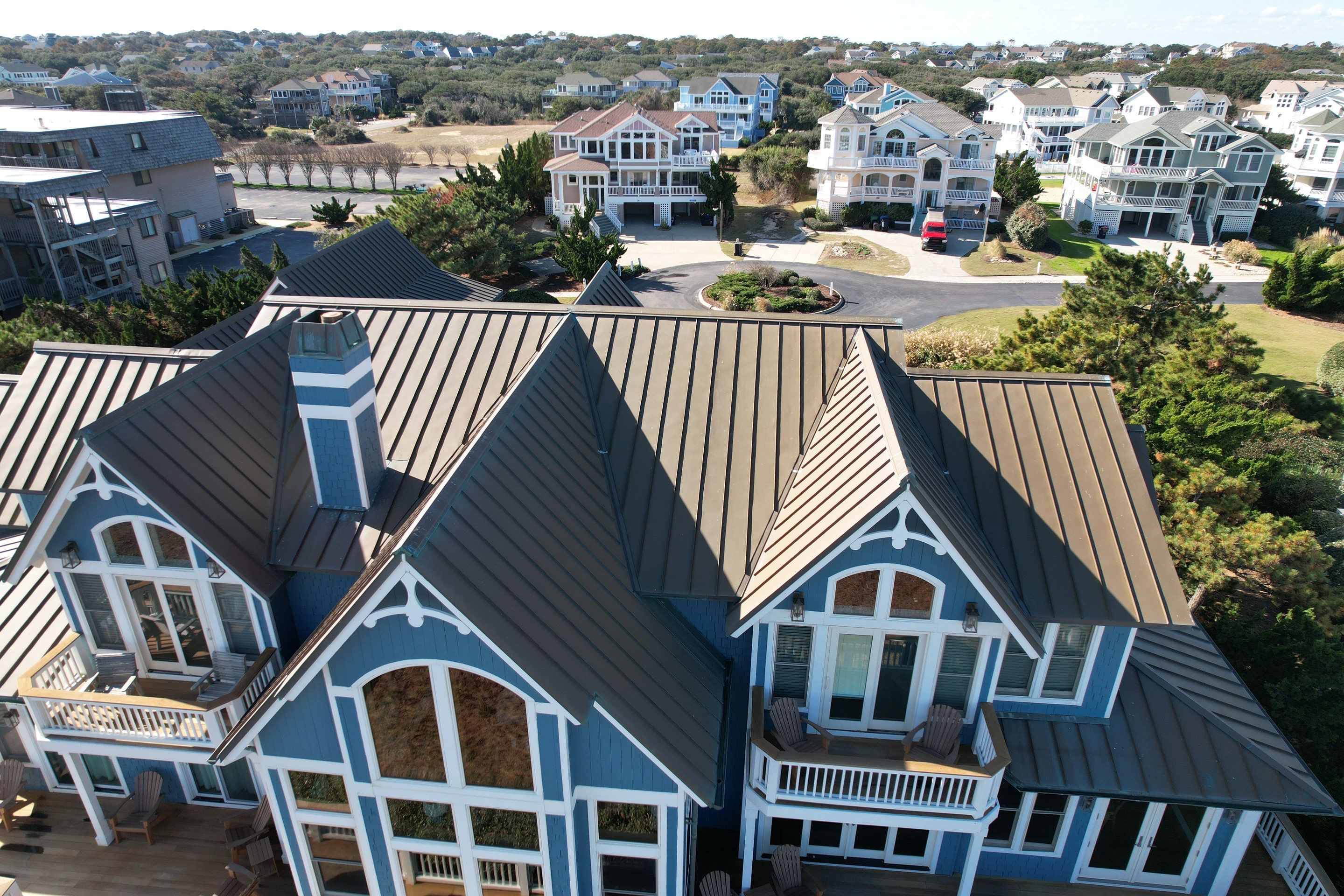 Large Metal Roof Transformation by Gallop Roofing & Remodeling, Inc.