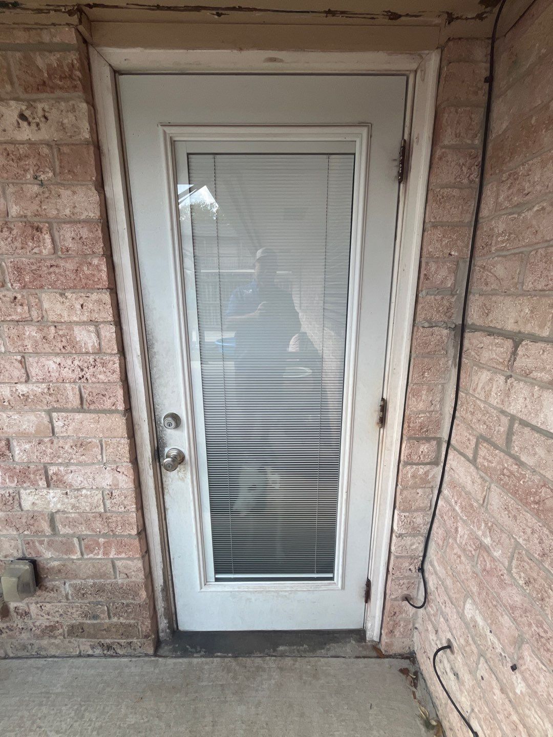 Colored Vinyl Windows to blend into brick by Bayfront Roofing and Construction