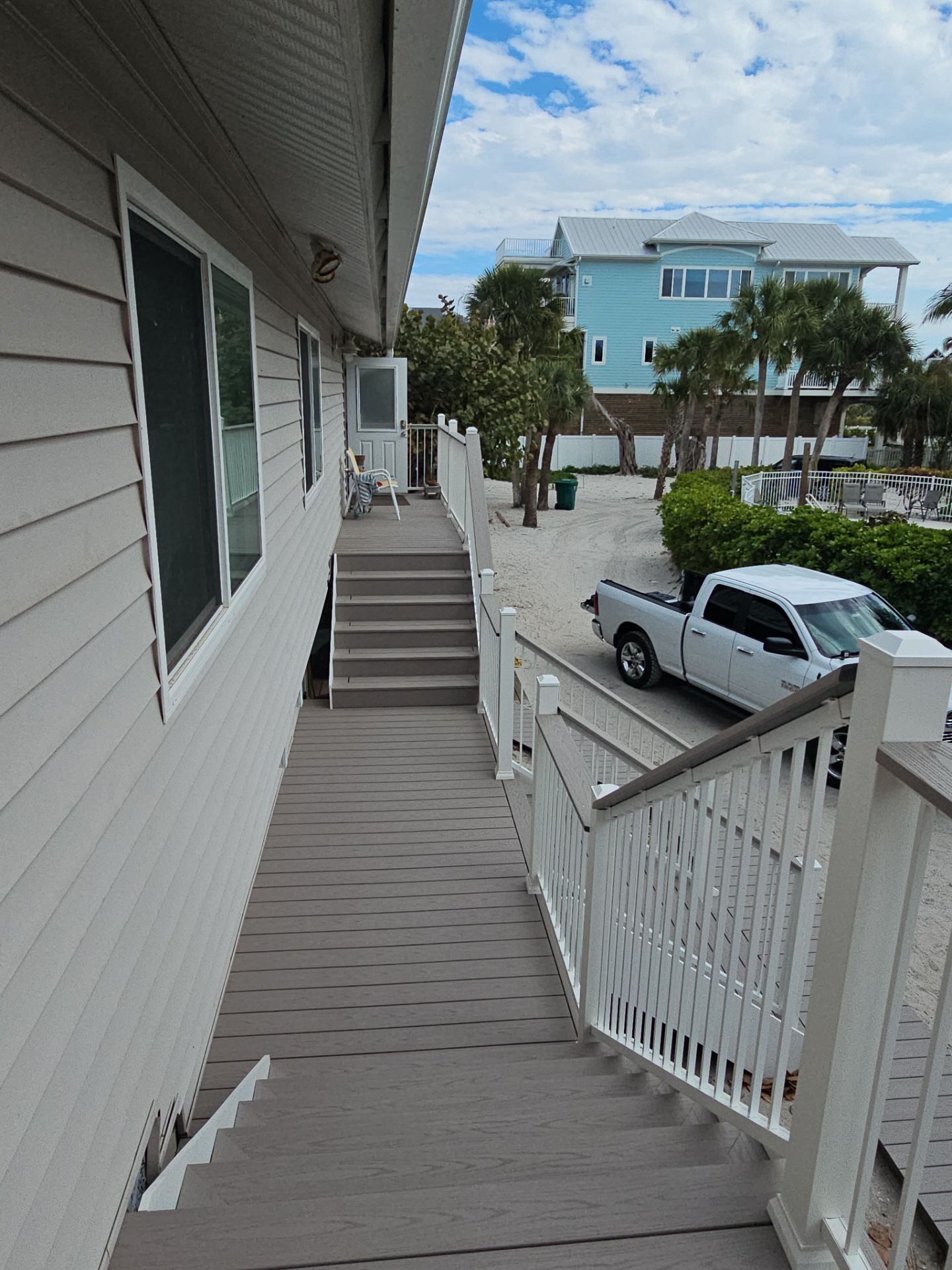 Elevated Composite Deck and Symmetrical Staircase Replacement in Englewood by Smirnov Construction Inc