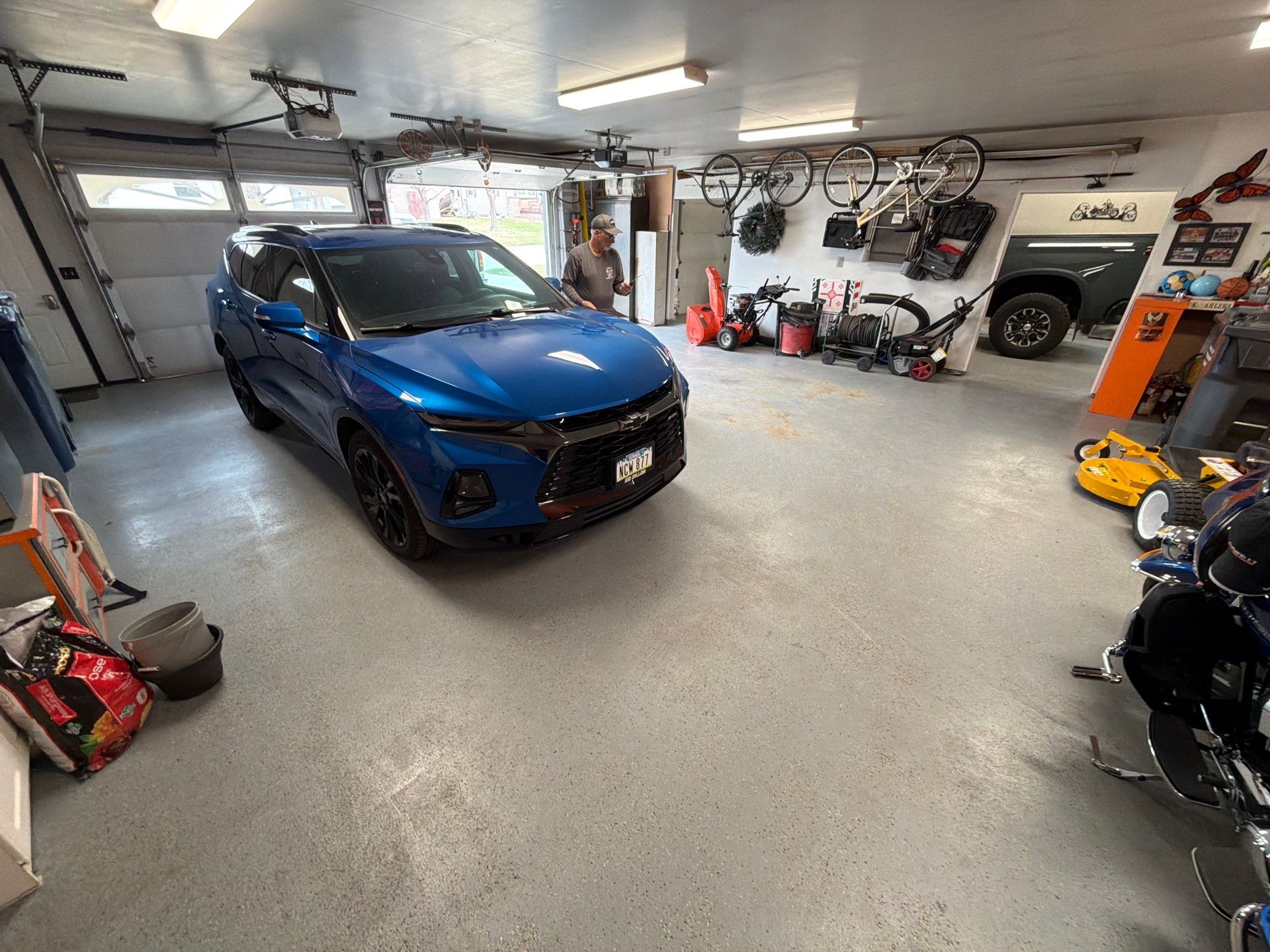 Custom Grey Flake Epoxy Garage Floor Installation in Remsen by Select Painting, Coatings & Garage Cabinets