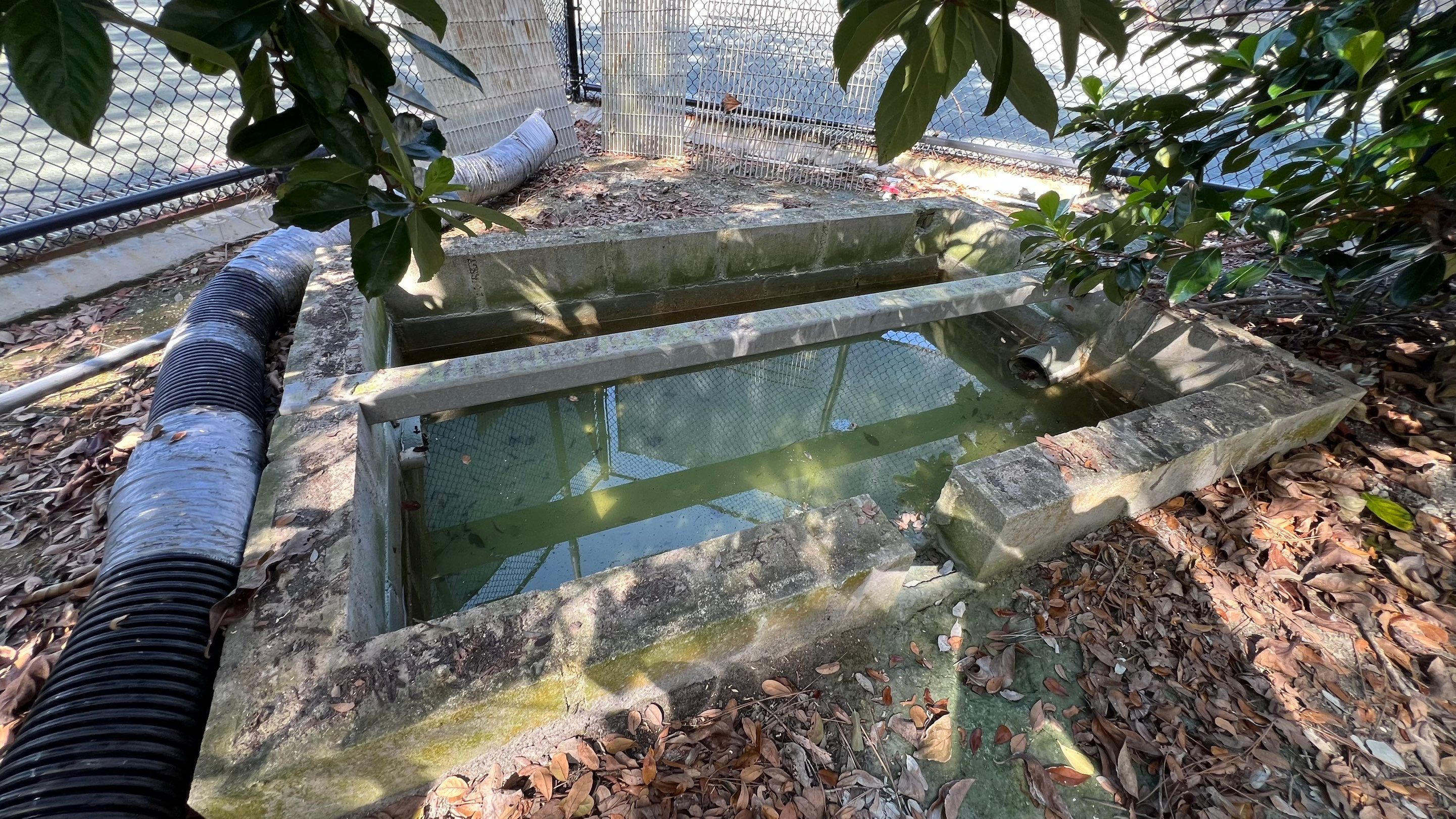 Pelican Landing Tennis Court Catch Basin Cleaning by APS Power & Water