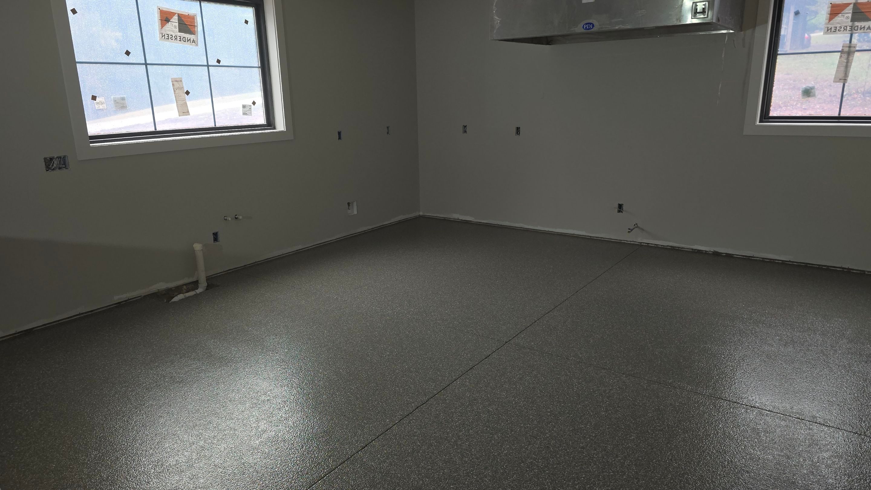 Shop Floor Using Custom Flake by Elite Floor Solutions