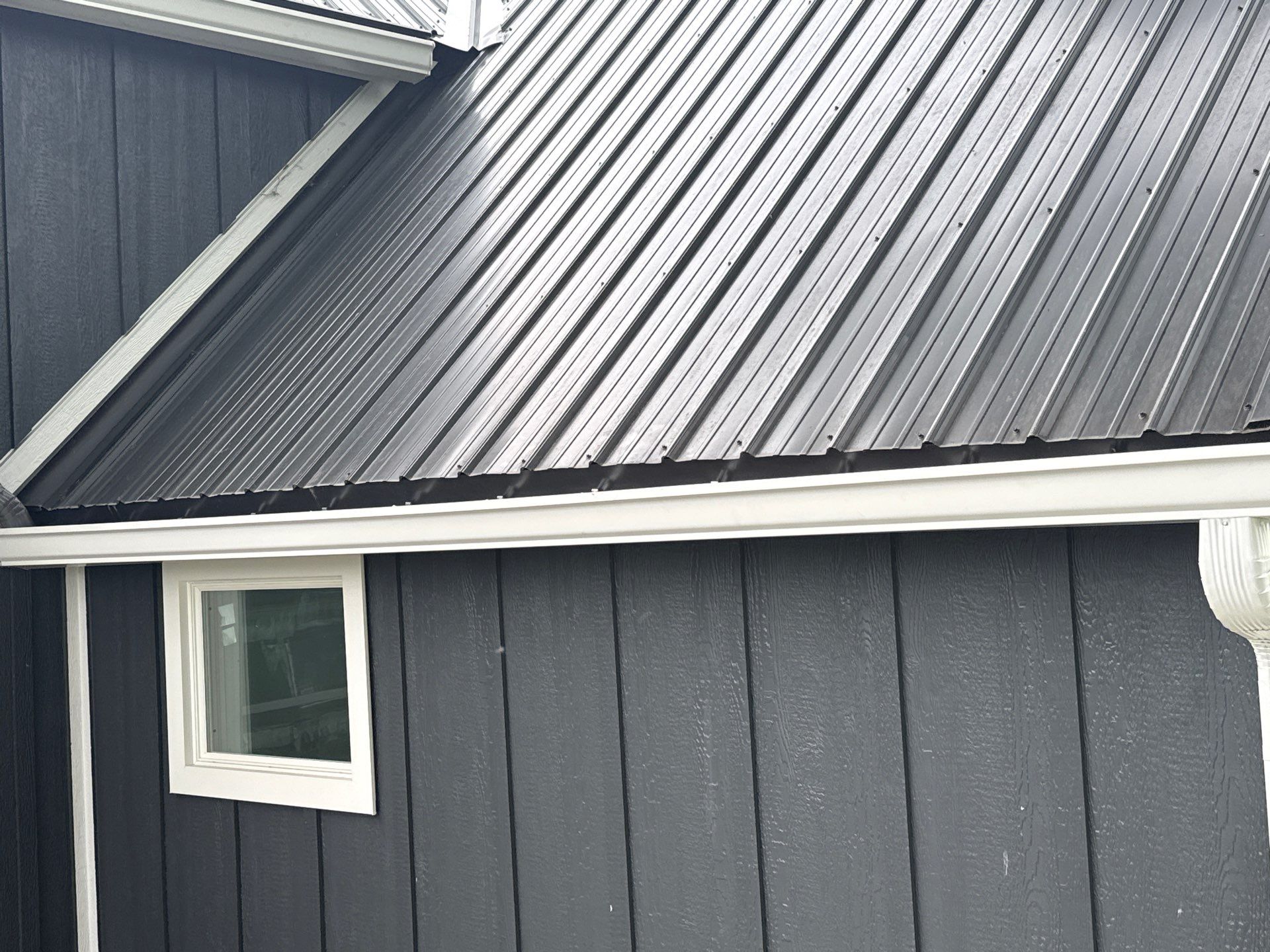 Seamless Gutter and Gutter Helmet Installation on Bellaire Metal Roof by Rainbow Seamless Systems