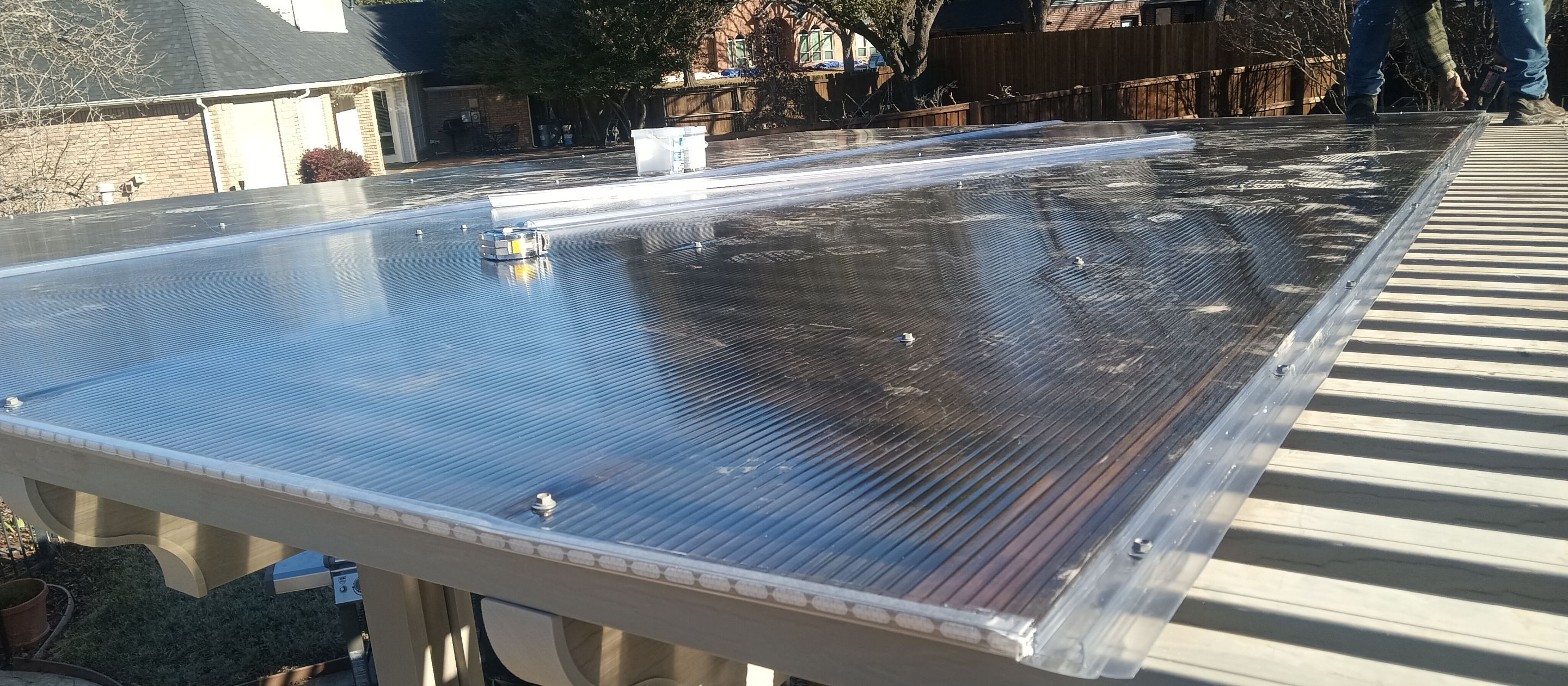 Polygal twin wall roofing system using 8mm bronze twin wall polygal by Grizzly Fence And Patio