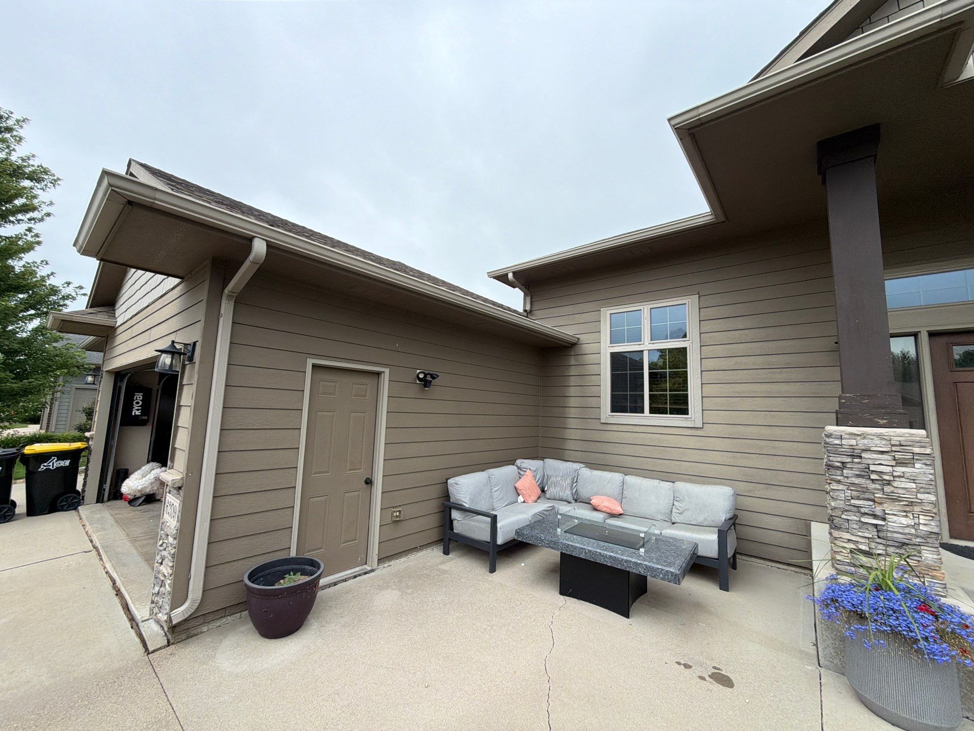 Full Exterior Siding Repaint for Sioux Falls Home and Garage by Select Painting, Coatings & Garage Cabinets
