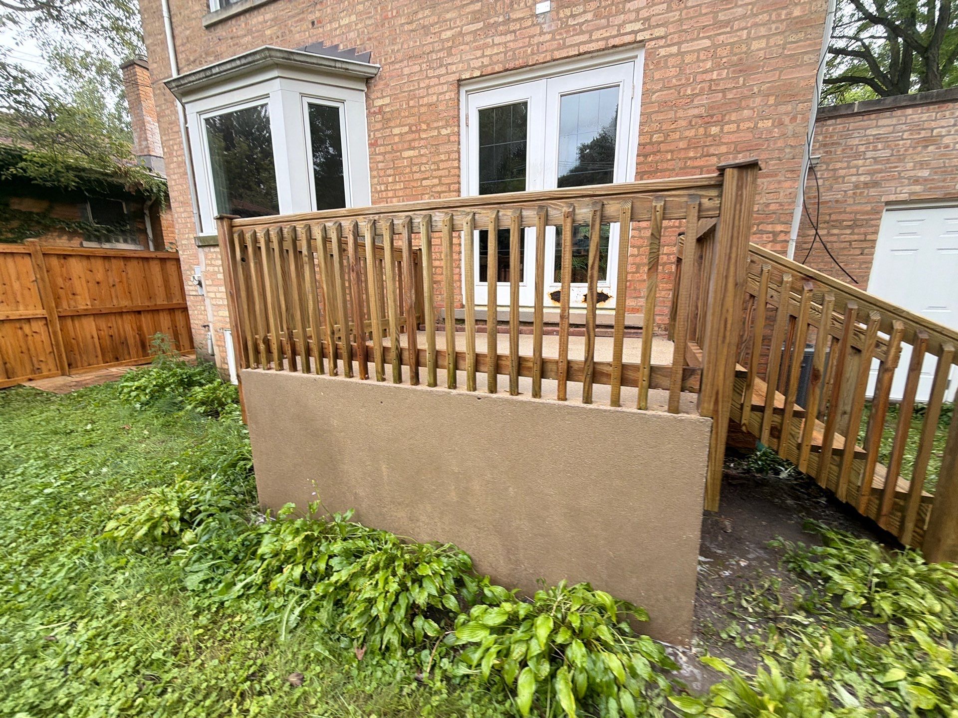 Wood fence cleaning and sealing by Northern Power Washing LLC.