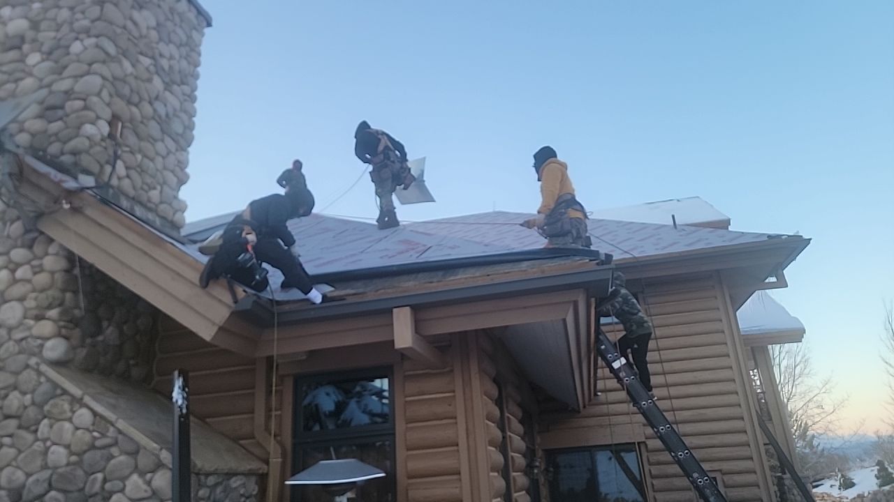Standing Seam Metal Roof Replacement After Snow Damage by ASAP Roofing & Restoration