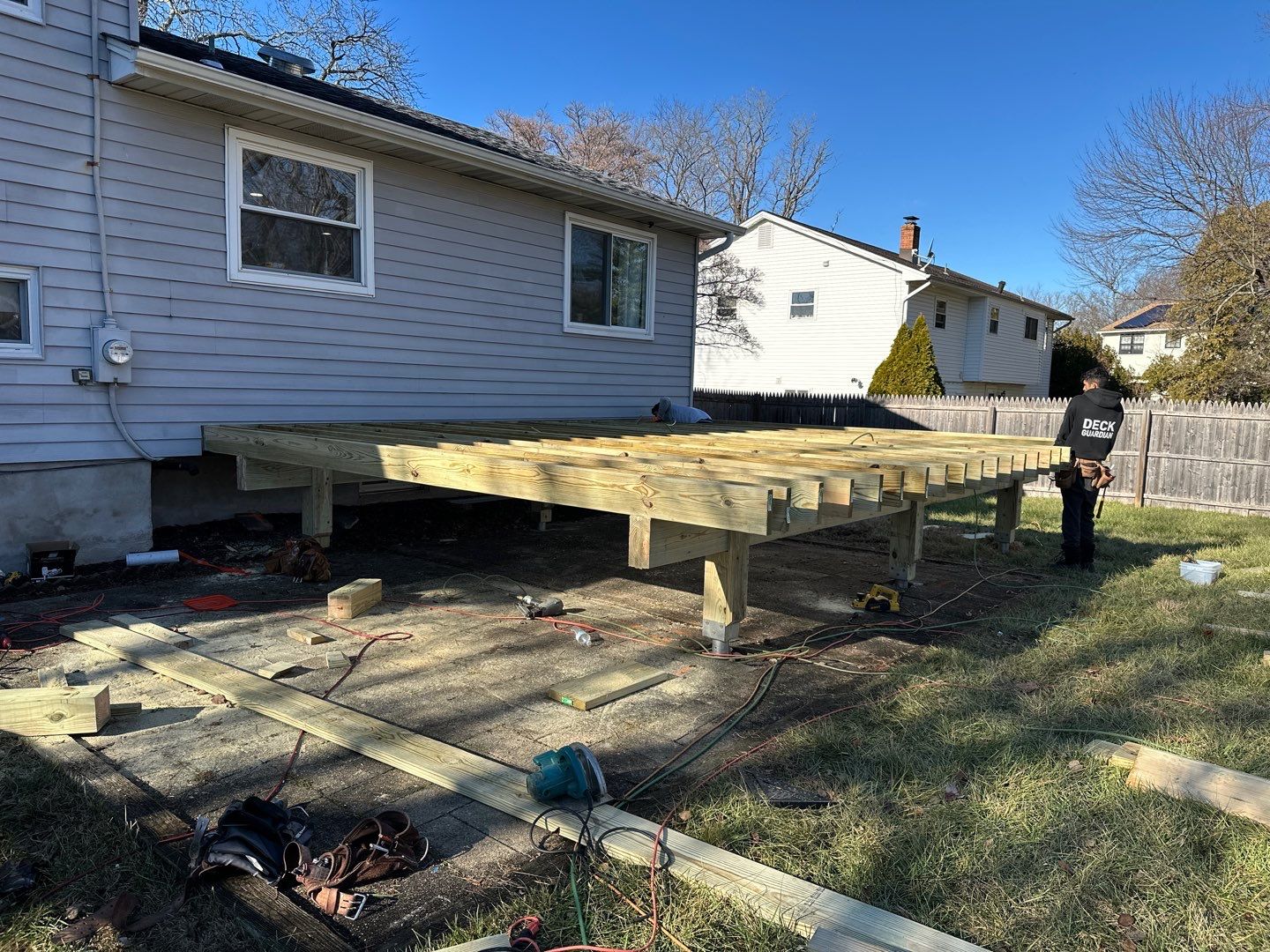 New deck construction and replacement of window with new sliding door  by deck guardian