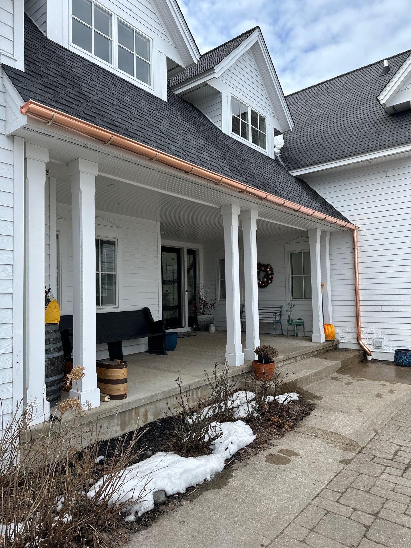 Copper Gutter and Downspout Installation in Suttons Bay by Rainbow Seamless Systems