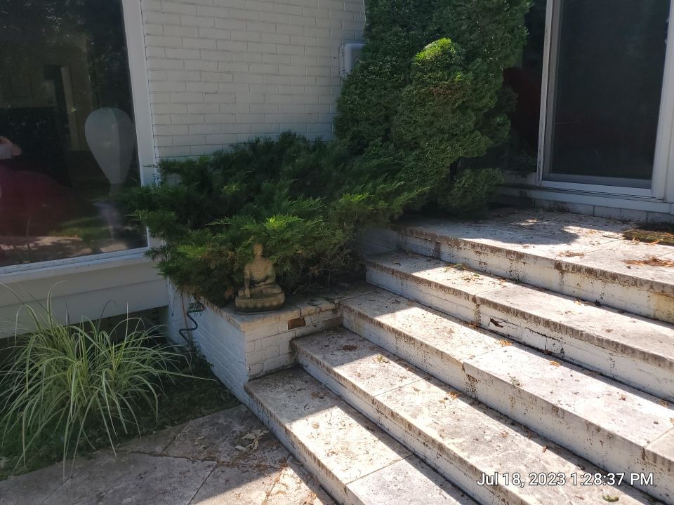 marble patio cleaning and sanding using Polysweep polymeric sand by Northern Power Washing LLC.