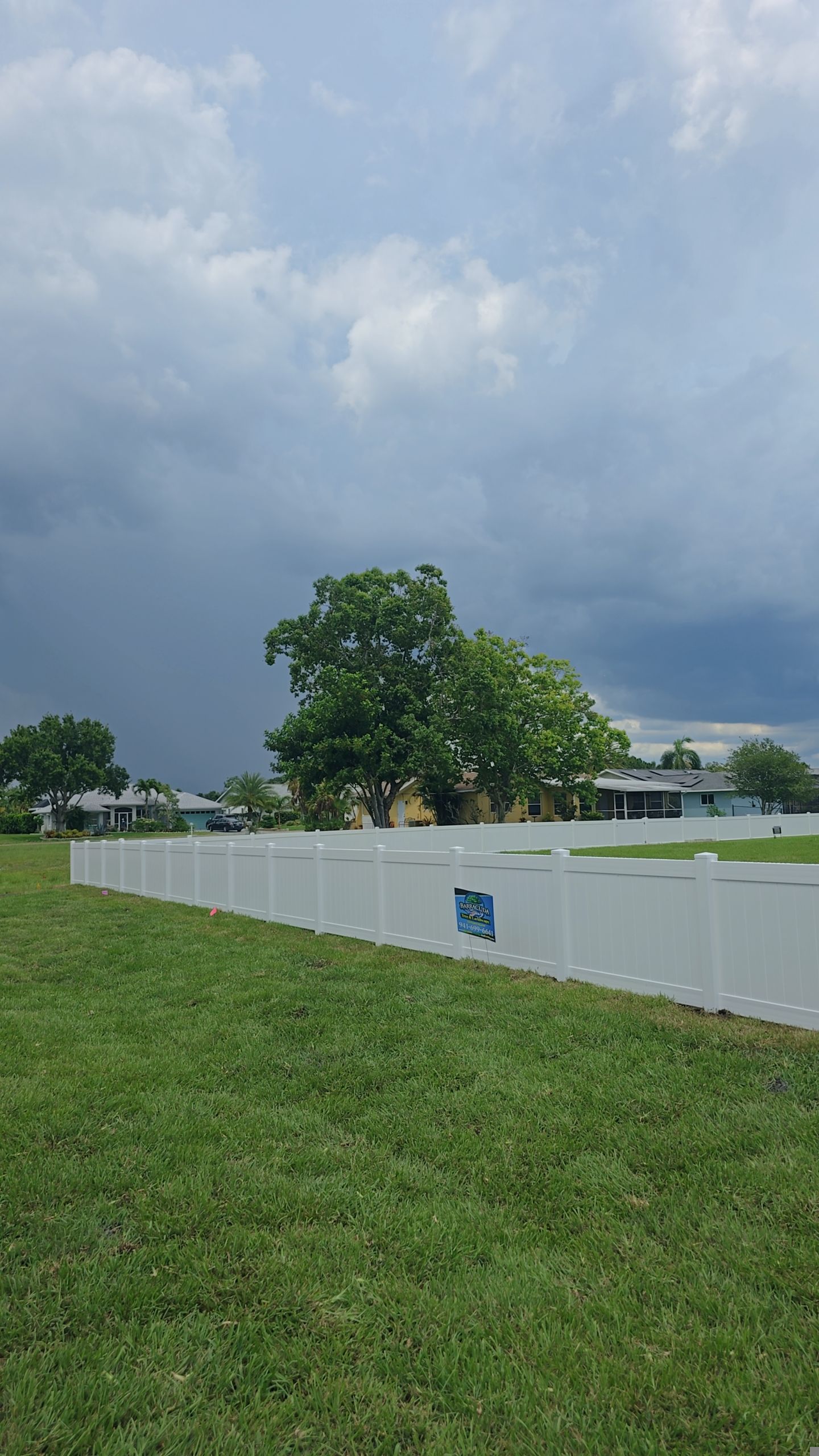 White Vinyl Privacy Fence Installation on Port Charlotte Corner Lot by True Fence LLC