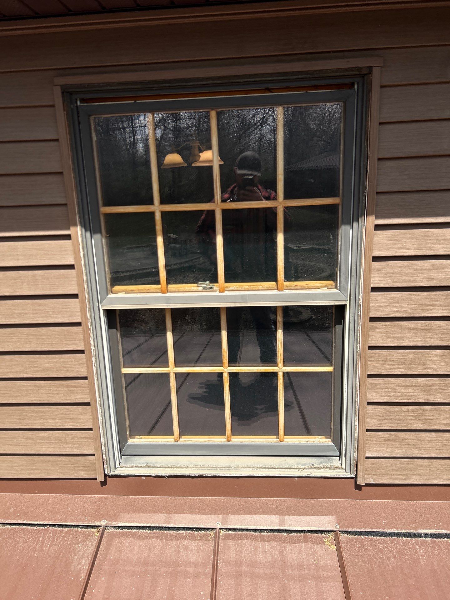 Pella Window installation using Pella Lifestyle wood/Aluminum window by United Windows and Siding LLC