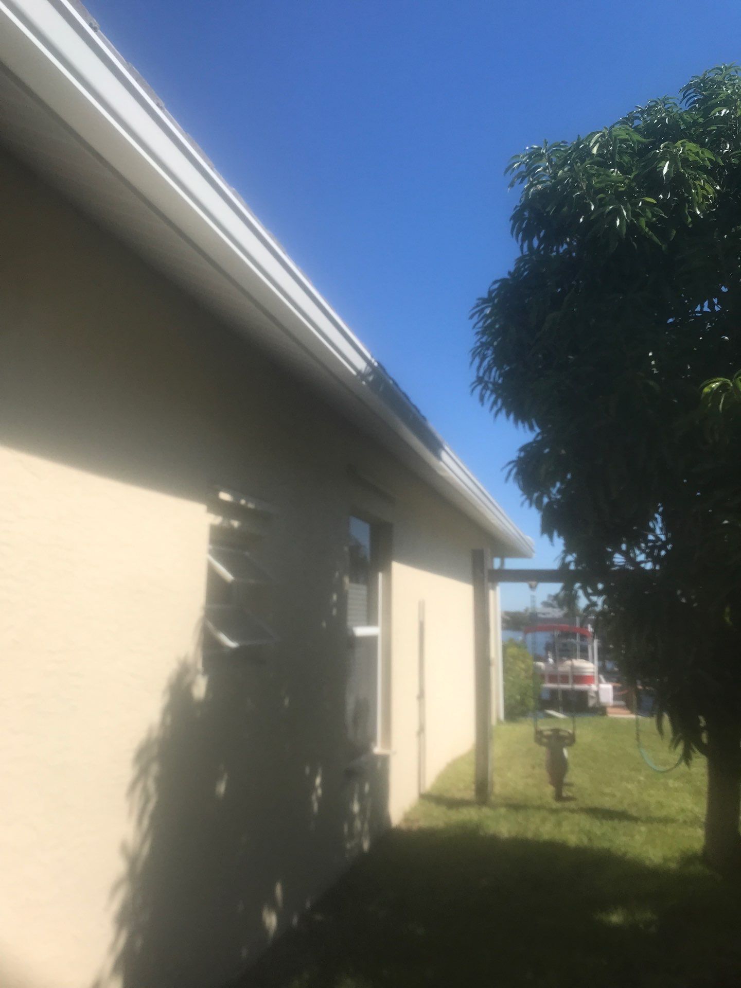 Seamless Gutters using Splash Guard in Cape Coral FL by Gutter Professors