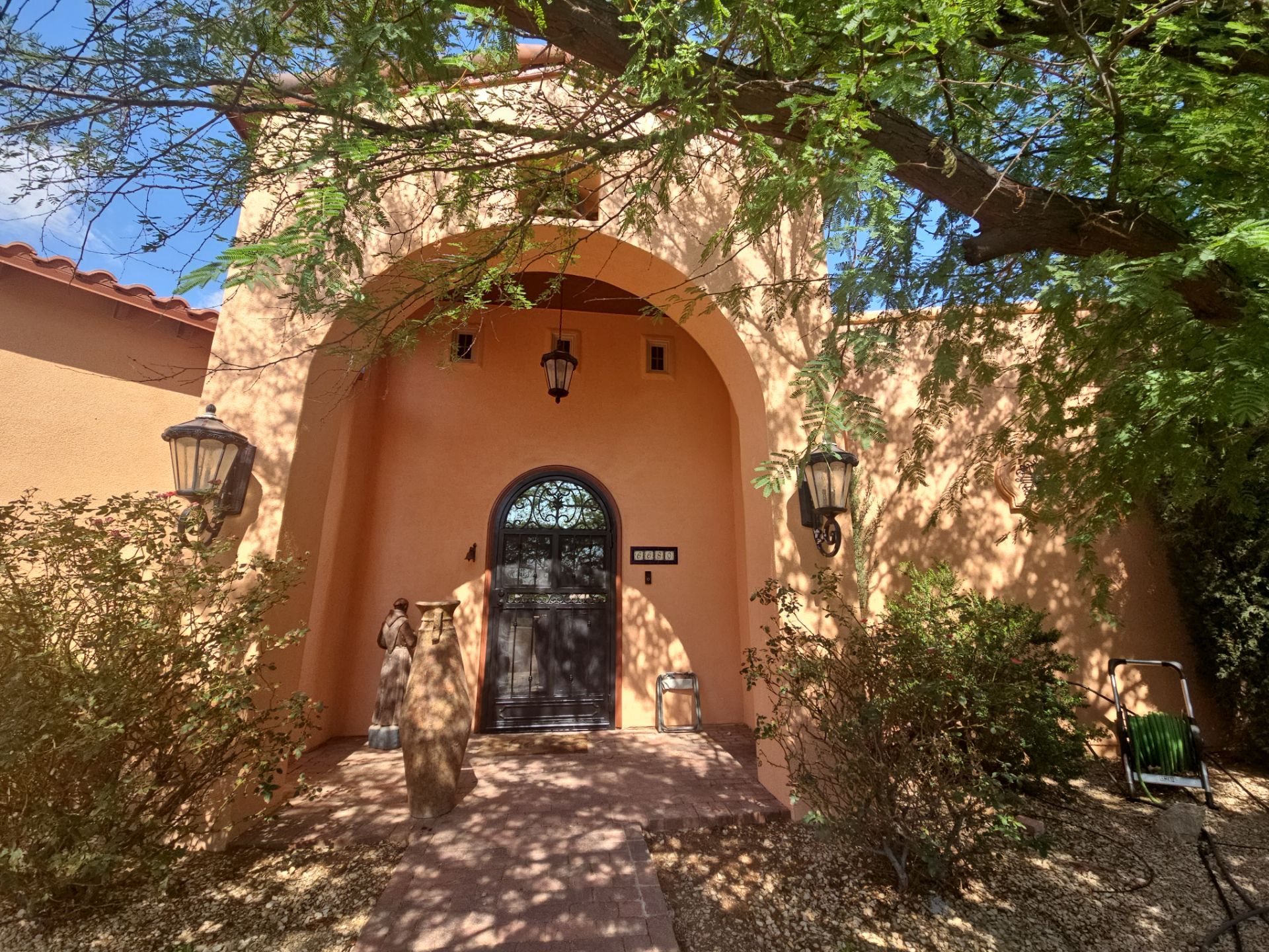 Exterior Painting with Stucco Damage by Regal Renovate