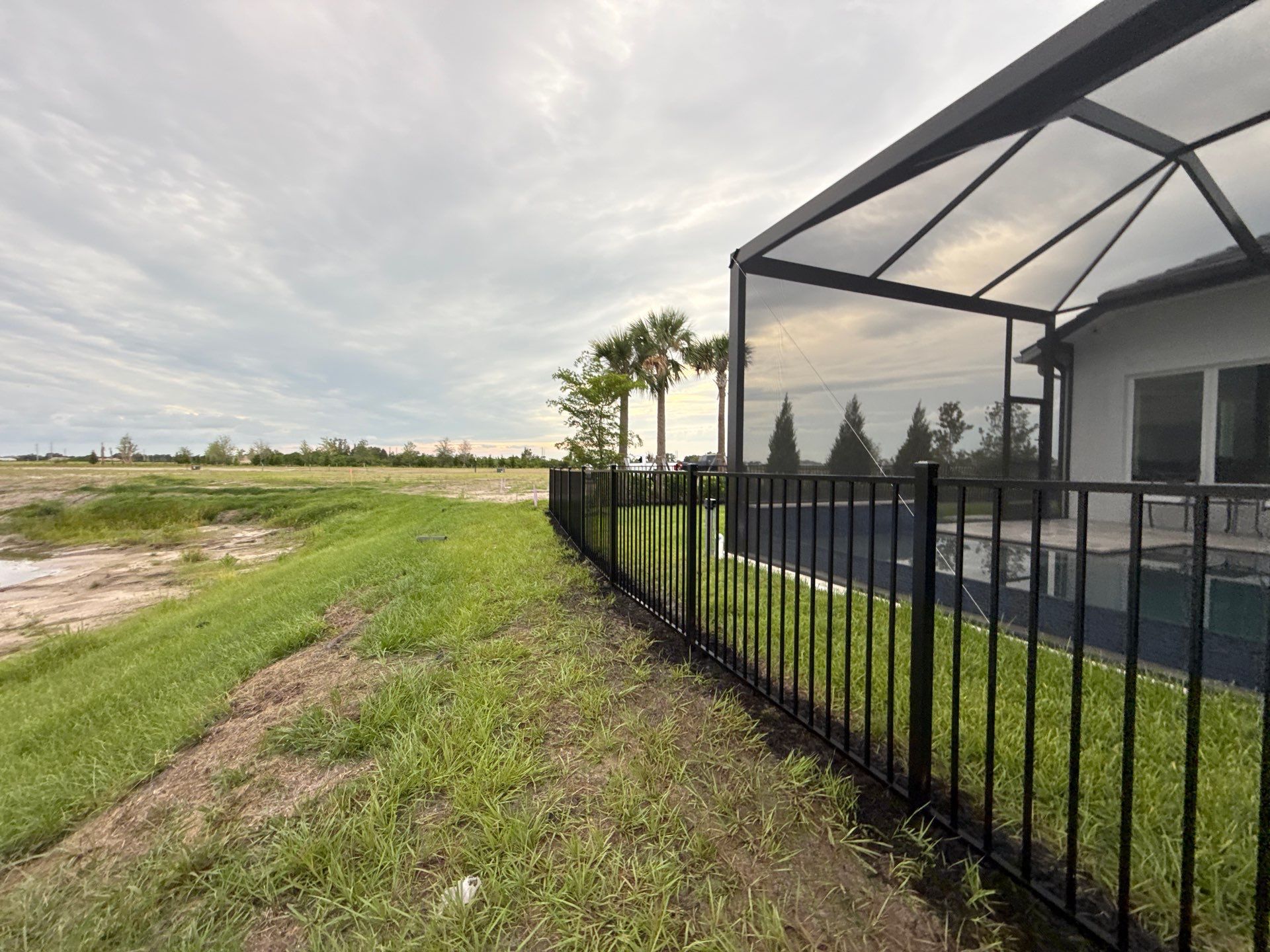 Black Aluminum Picket Fence Installation in Venice, Florida by True Fence LLC