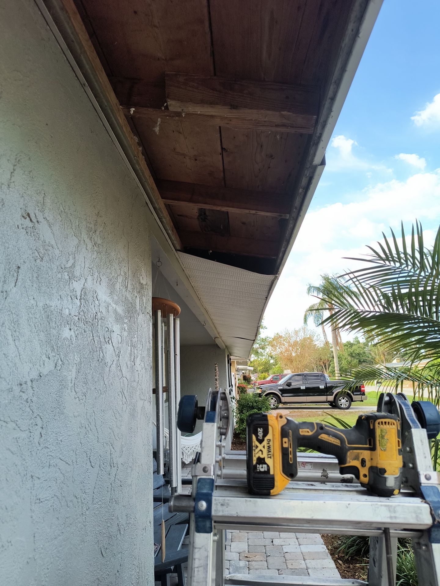Black Seamless Gutters using 7 inch seamless gutters & New White Soffit in Sarasota FL by Gutter Professors