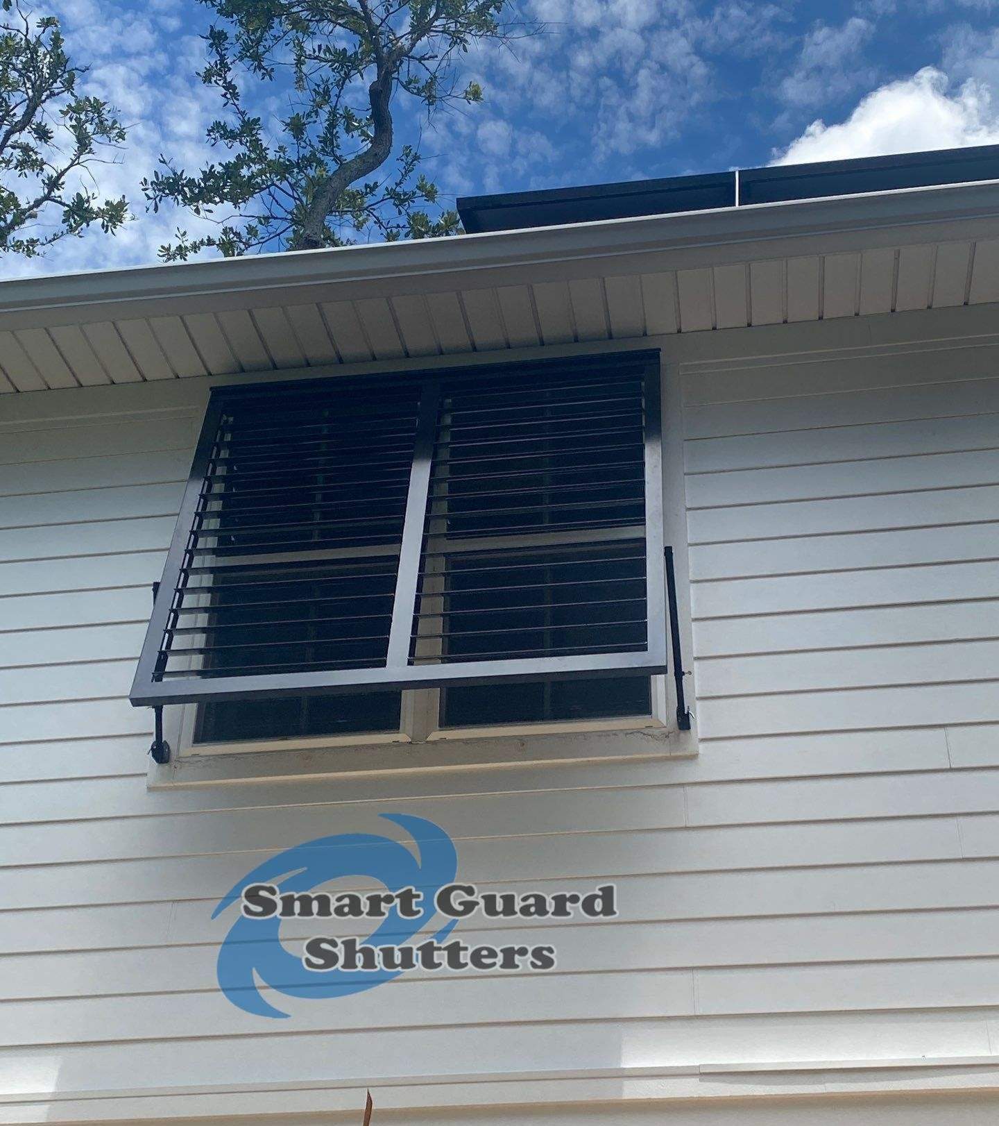 Impact Bahama Shutters in Jet Black by Smart Guard Shutters