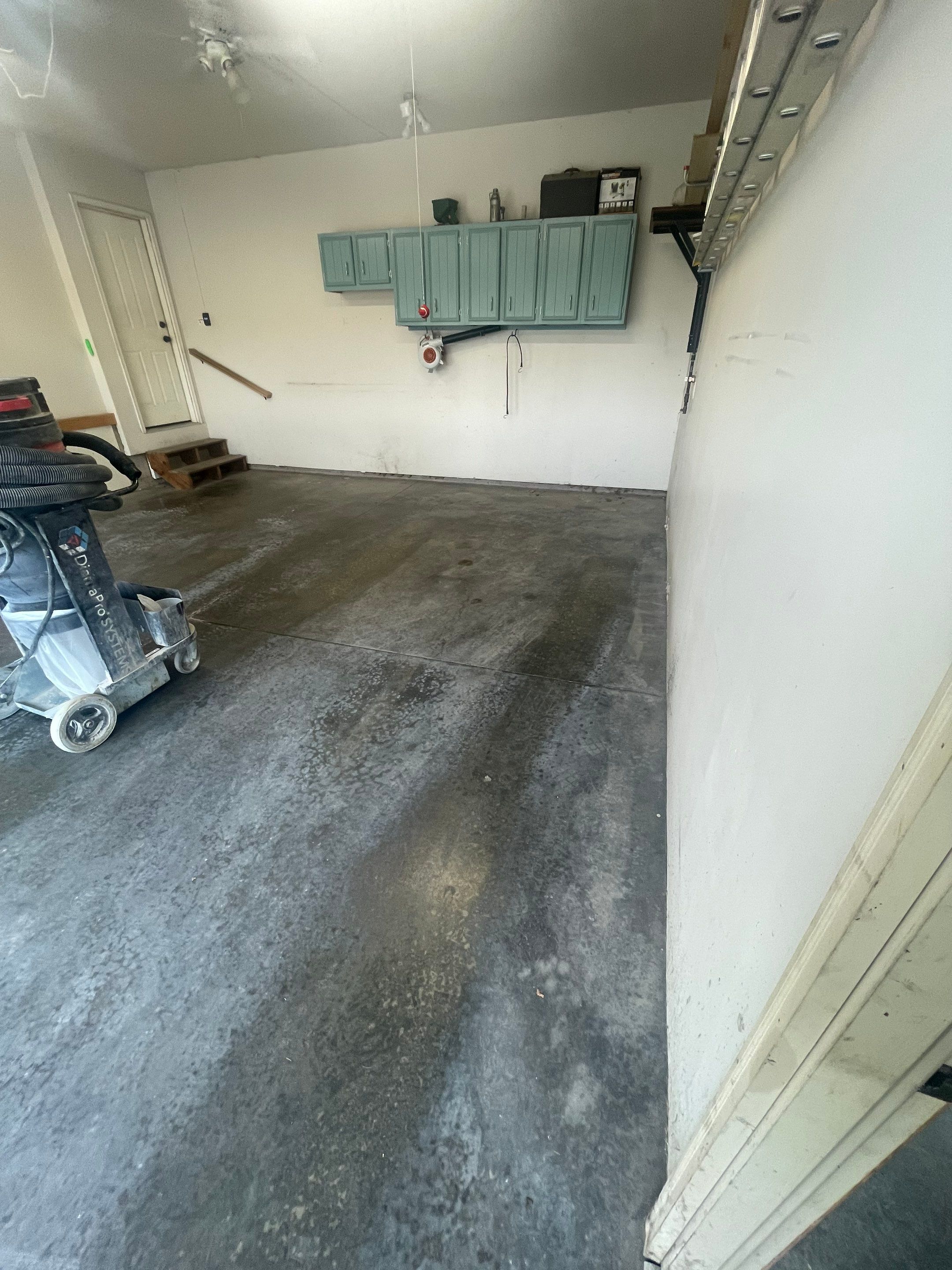 Multi-Stall Garage Floor Coating Installation in Sioux Falls by Select Painting, Coatings & Garage Cabinets