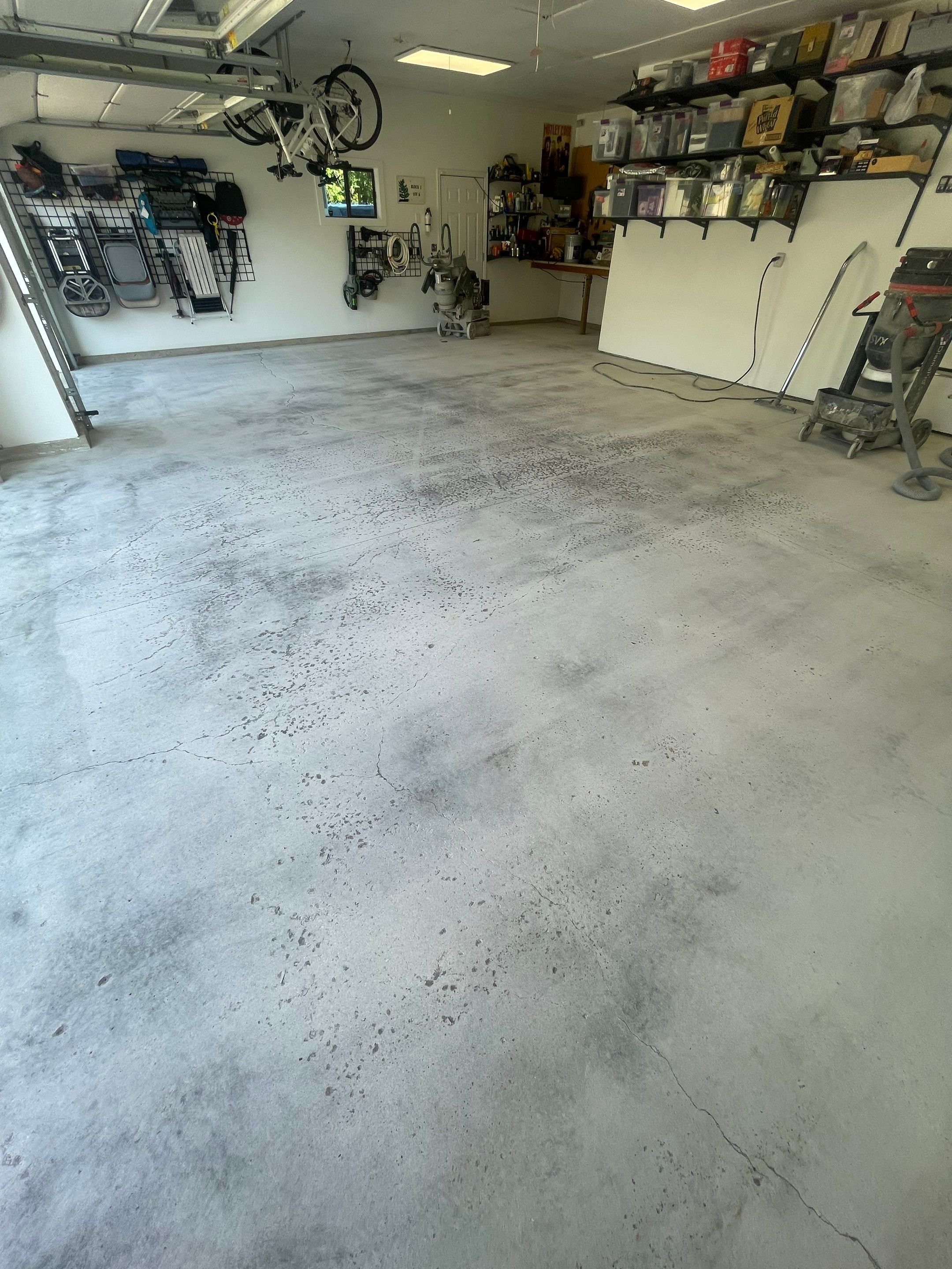 Feather Grey Garage Floor Coating Installation in Sioux Falls by Select Painting, Coatings & Garage Cabinets