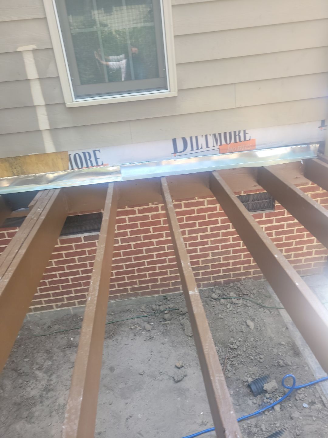 Fuquay-Varina Outdoor Upgrade – Composite Deck & Paved Landing by Elite Remodeling and Design LLC