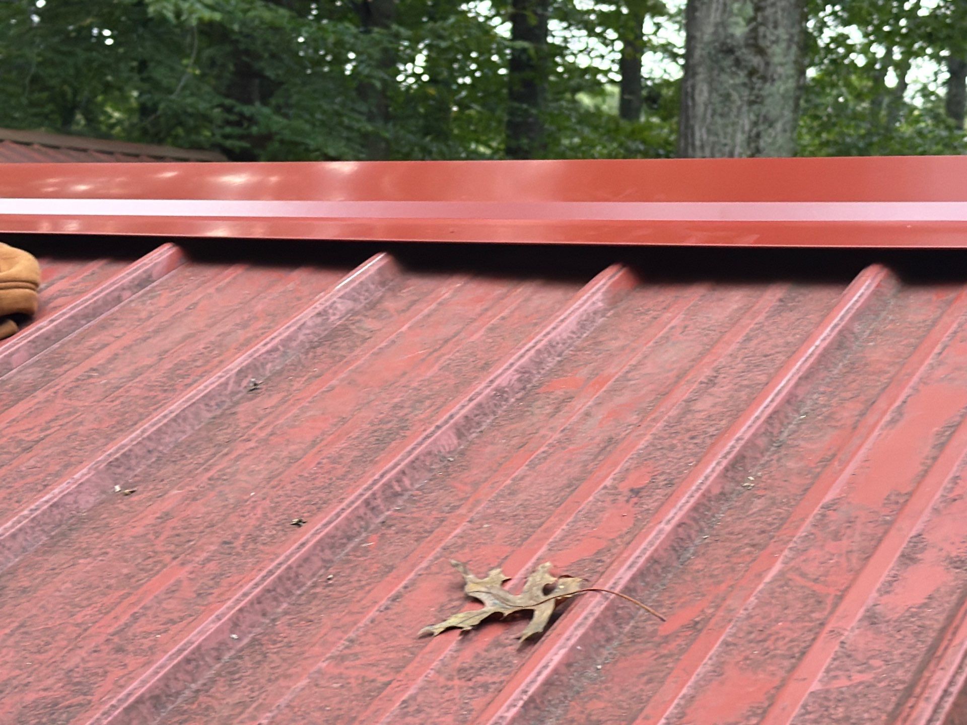 Red Metal Roof Restoration and Wood Fascia Replacement in Barboursville by Cade Construction