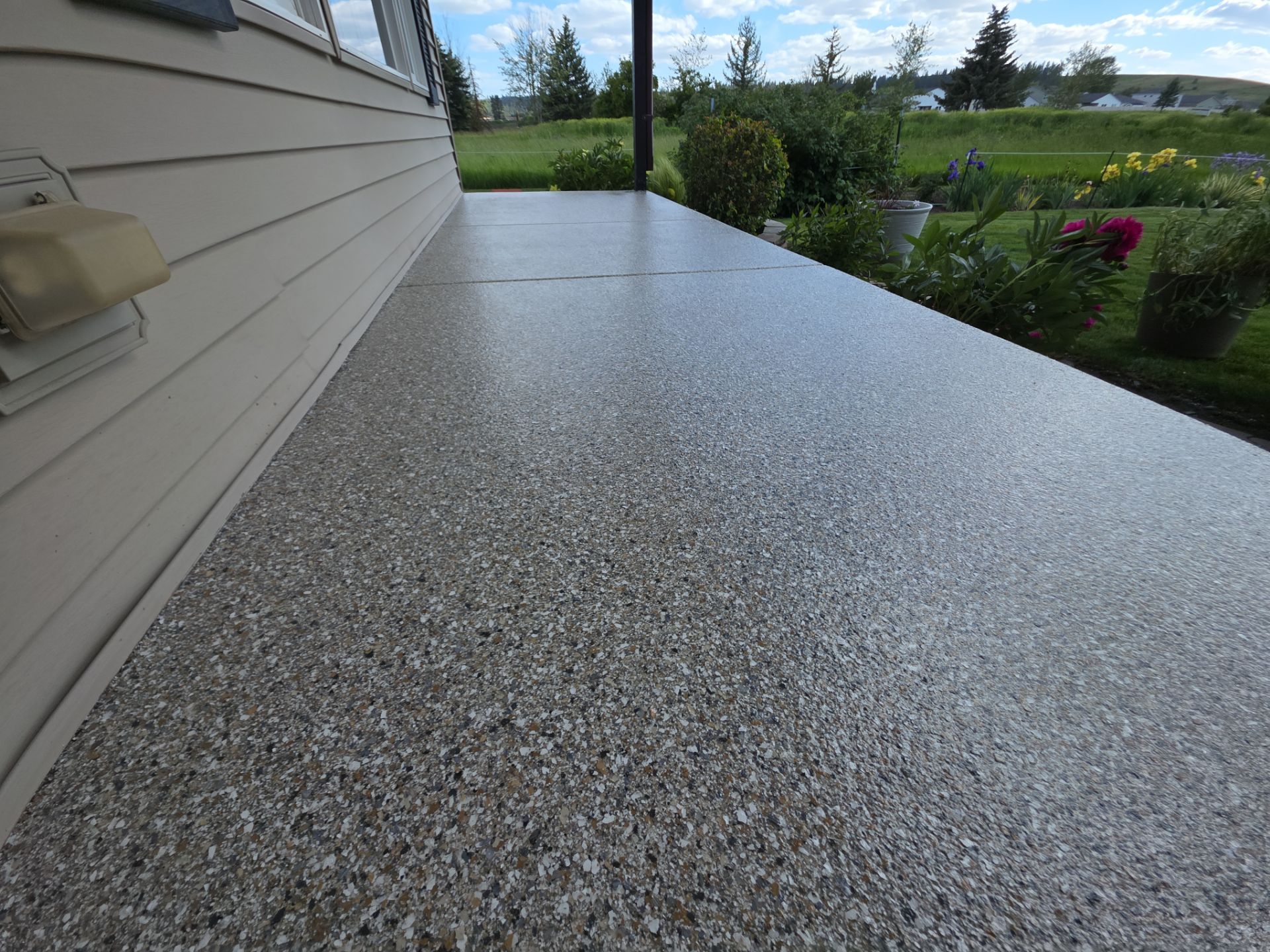 Concrete Patio and Walkway Coating Transformation in Cheney by Croc Coatings, LLC