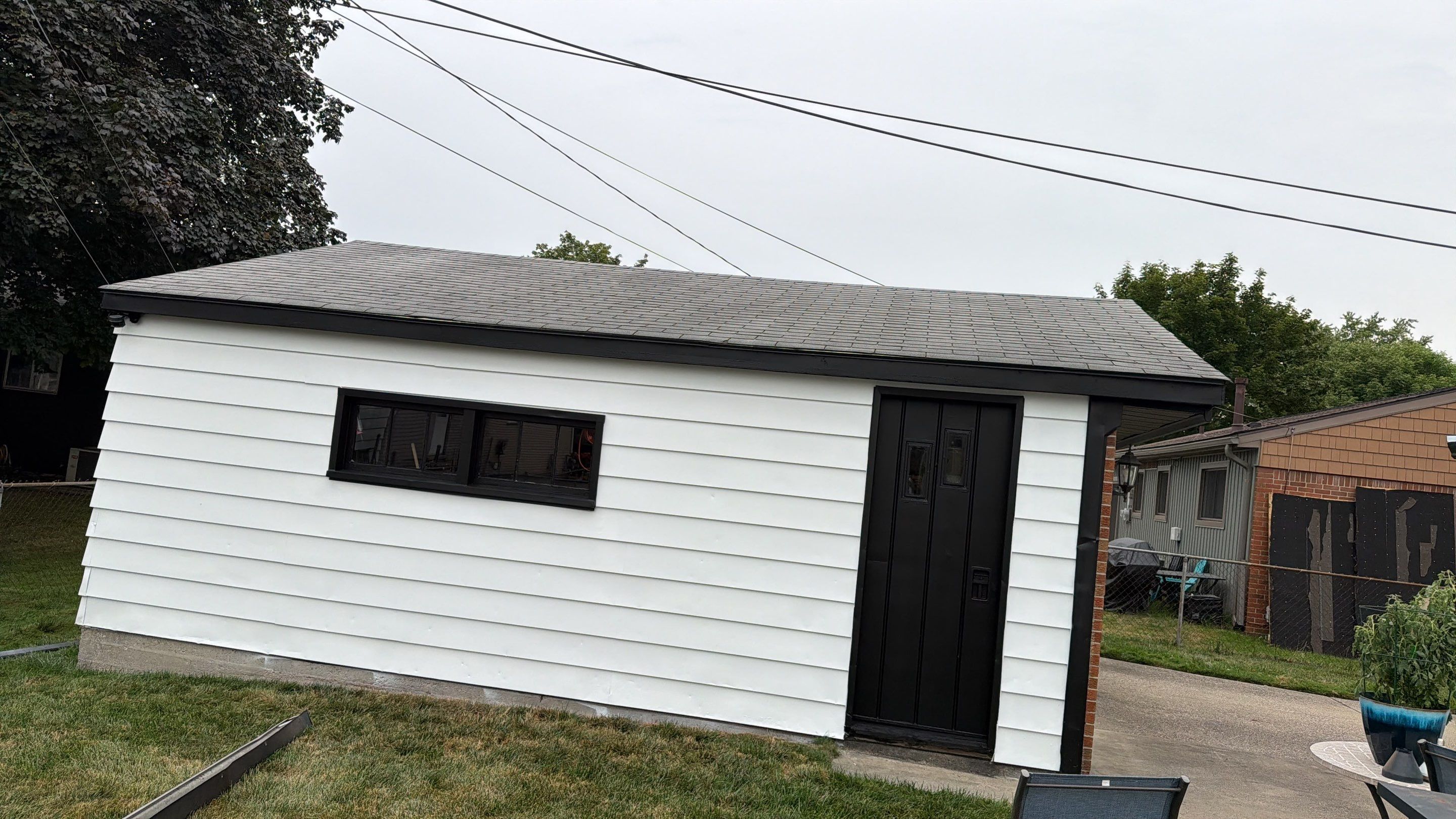 White Vinyl Siding and Gutter Installation in Sterling Heights by Top Shelf Painter