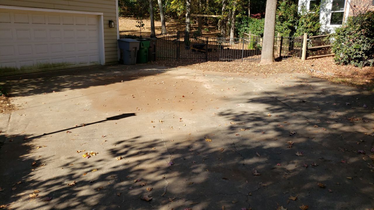 Driveway Clean using cleaner by Power Wash Masters LLC